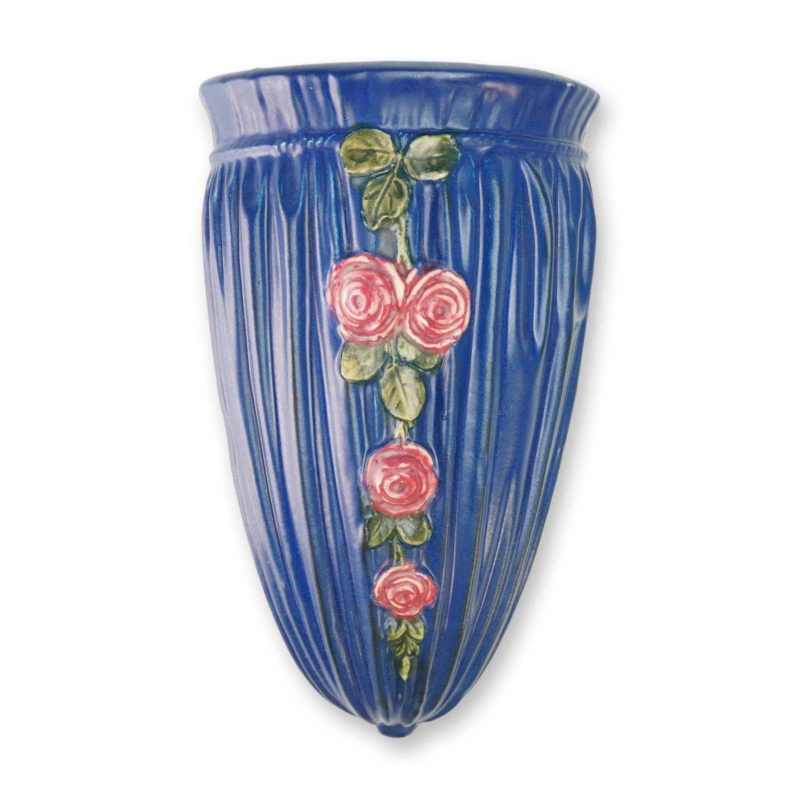 Weller Pottery Rose Wall Pocket, Blue Drapery: A Weller Pottery ceramic wall pocket in the Blue Drapery pattern featuring a rose motif. The vessel is designed with a tapered, fluted body finished in a deep cobalt blue glaze. The front decoration c