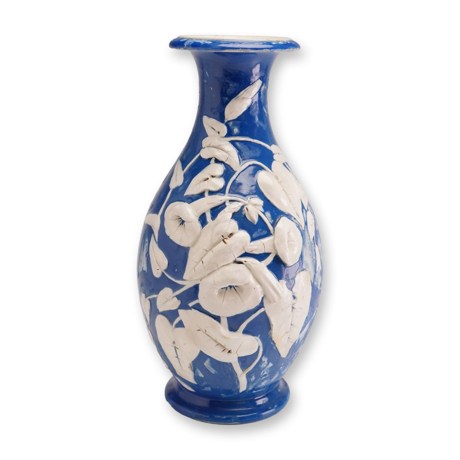 Wedgwood Free-form Relief Dark Blue Jasper Dip Vase: A Wedgwood glazed earthenware vase of ovoid form with a flared neck and circular pedestal base. The body is decorated with high-relief white sprigged botanical motifs depicting morning glory flowers a