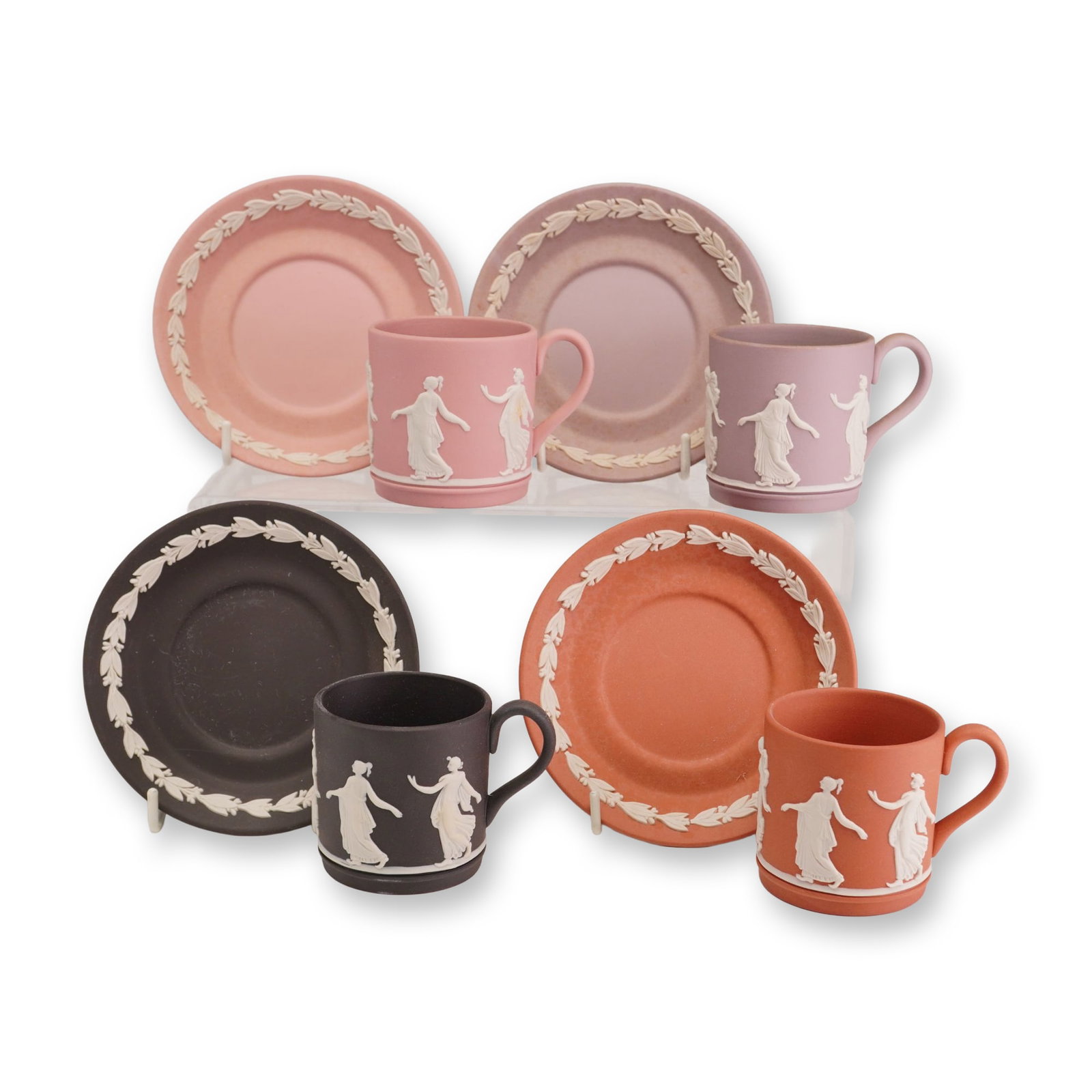 8pc Wedgwood Jasperware Dancing Hours Cups and Saucers: This set of four Wedgwood jasperware demitasse cups and matching saucers features four distinct colors: black, terracotta (rosso antico), lilac, and pink. Each piece is crafted from unglazed stoneware