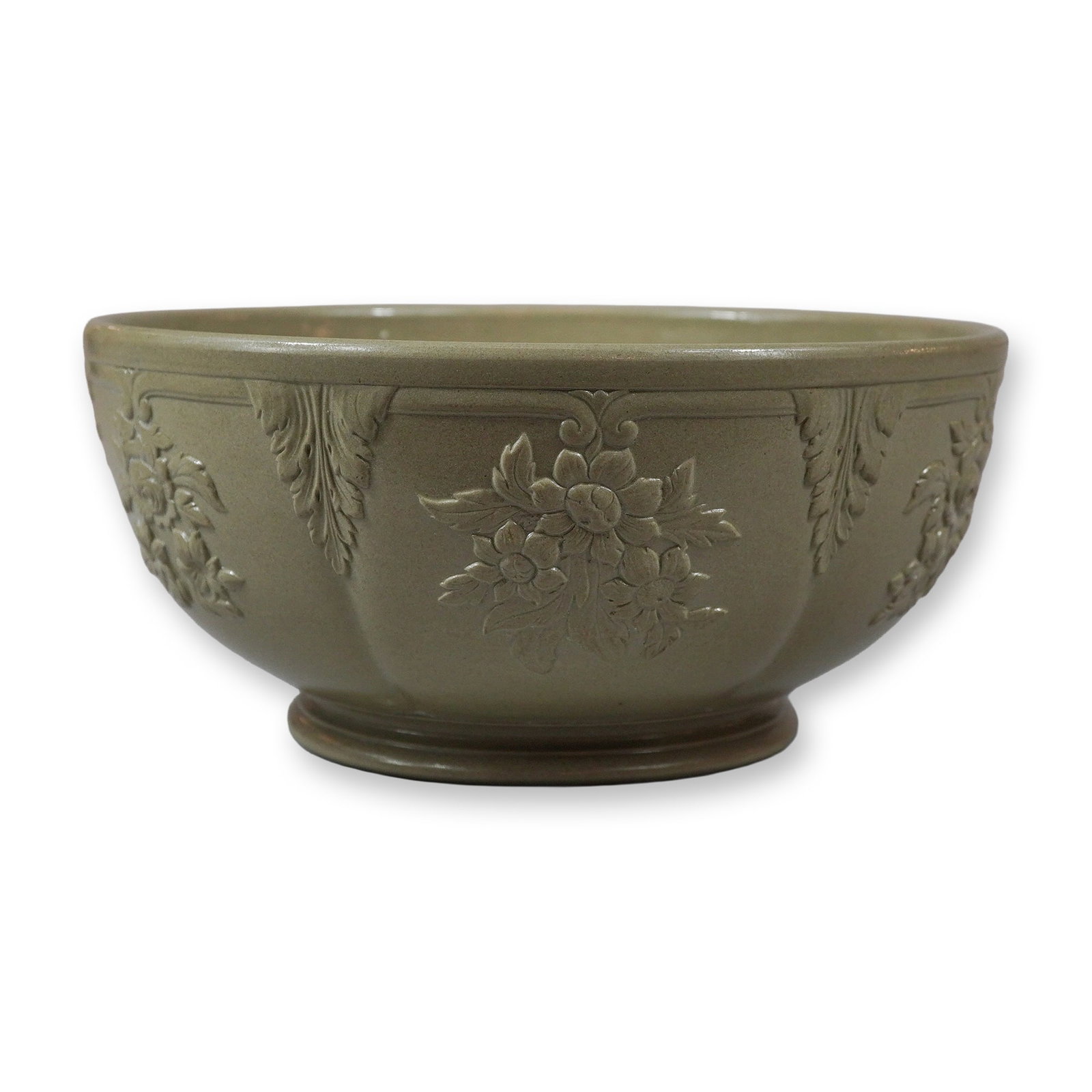 Wedgwood Drabware Stoneware Lobed Bowl with Floral Relief, circa 1820: A large, footed serving bowl constructed from drabware stoneware with a smear-glazed finish. The vessel features a lobed body with a slightly flared rim and an integral foot ring. The exterior is deco
