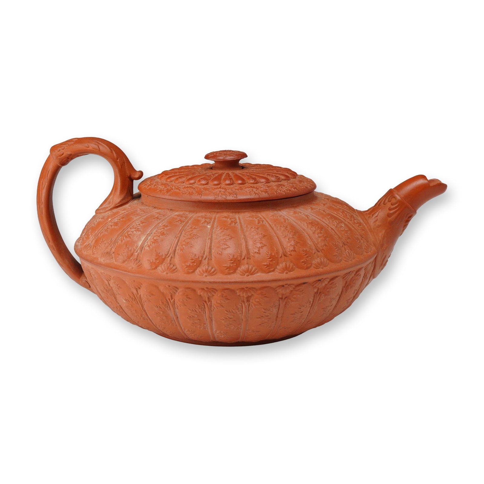Wedgwood Rosso Antico Leaf Mould Lidded Teapot, ca. 1820: A Wedgwood Rosso Antico stoneware lidded teapot, dated circa 1820. This unglazed red stoneware vessel features a compressed globular body decorated with sprigged bas-relief foliate and floral motifs a