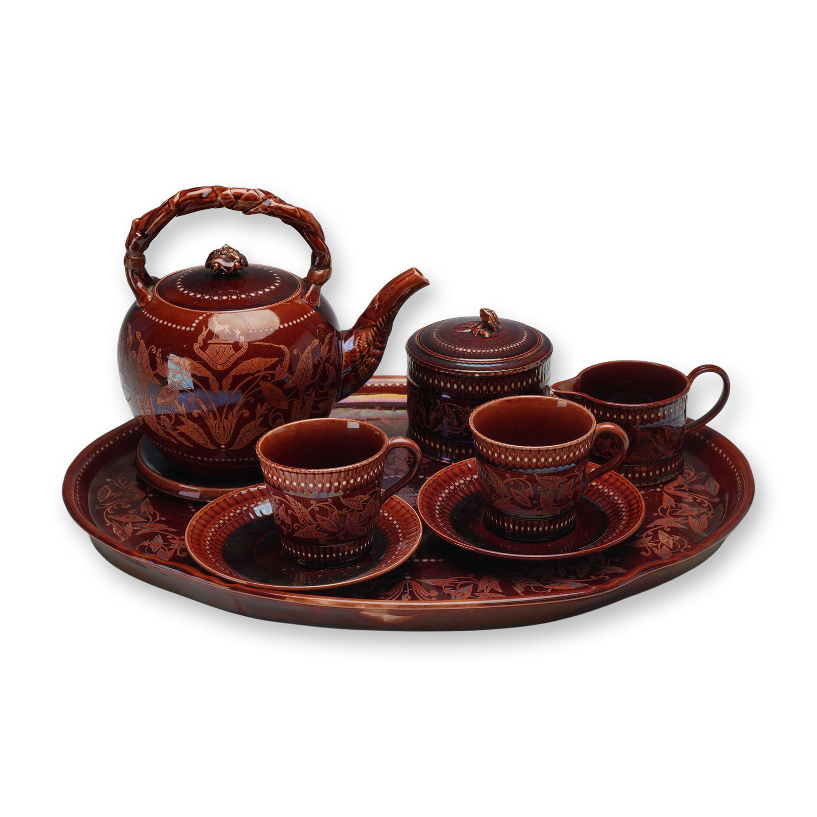 9pc Wedgwood Per Saxa Per Ignes Iridescent Lusterware Tea Service: This Wedgwood tea service is finished in a deep copper-toned iridescent luster glaze with blue, purple, and gold metallic highlights. The set features elaborate sgraffito and painted decoration consis