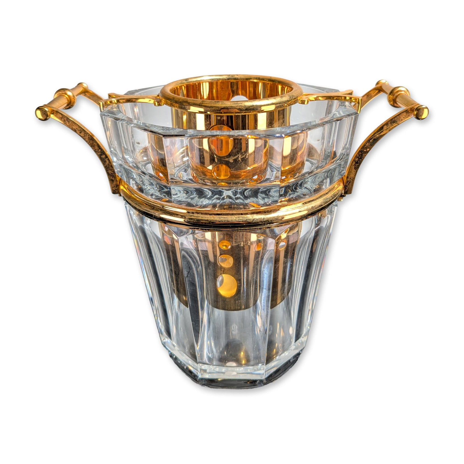 Baccarat Harcourt Crystal and Gilt Metal Champagne Cooler: Baccarat, France, Harcourt pattern champagne cooler in clear lead crystal with gilt metal hardware. The octagonal faceted crystal vessel features a fixed gilt metal band supporting two scrolling folia