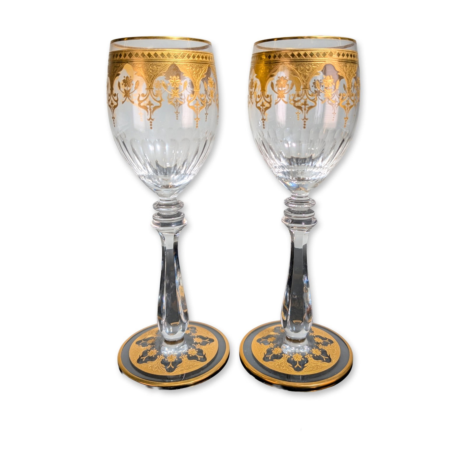 2pc Baccarat France Prestige Gold Encrusted Crystal Wine Glasses: Baccarat, France, pair of crystal wine goblets in Prestige pattern. The tulip-shaped bowls feature wide gold-encrusted bands at the rims with foliate and scrolled palmette decoration above vertical fl