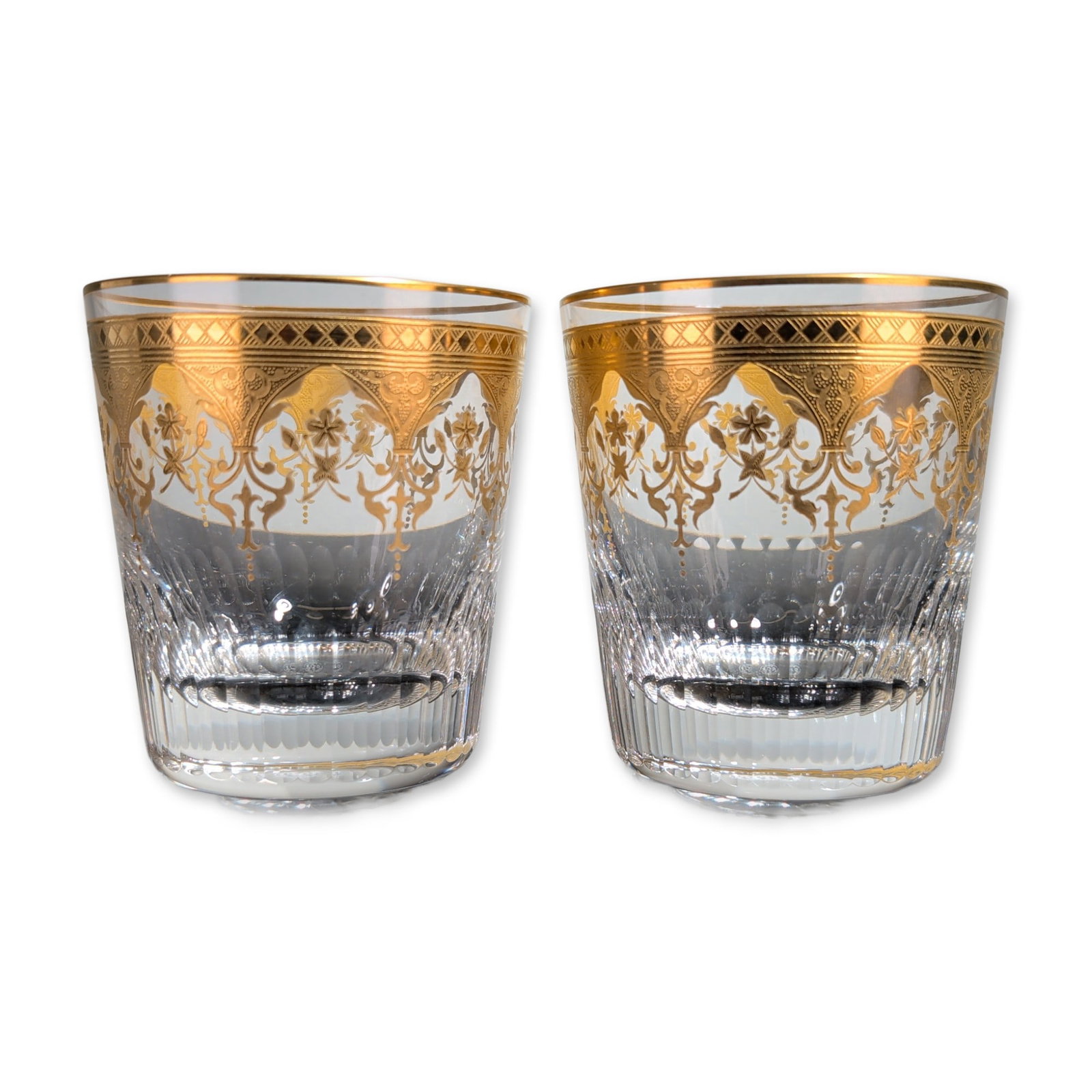 2pc Baccarat France Prestige Gold Encrusted Crystal Tumblers: Baccarat, France, pair of rocks glasses in lead crystal from the Prestige pattern, featuring acid-etched and gold-encrusted decorative borders. Each vessel is decorated with a gilt rim of diamond latt