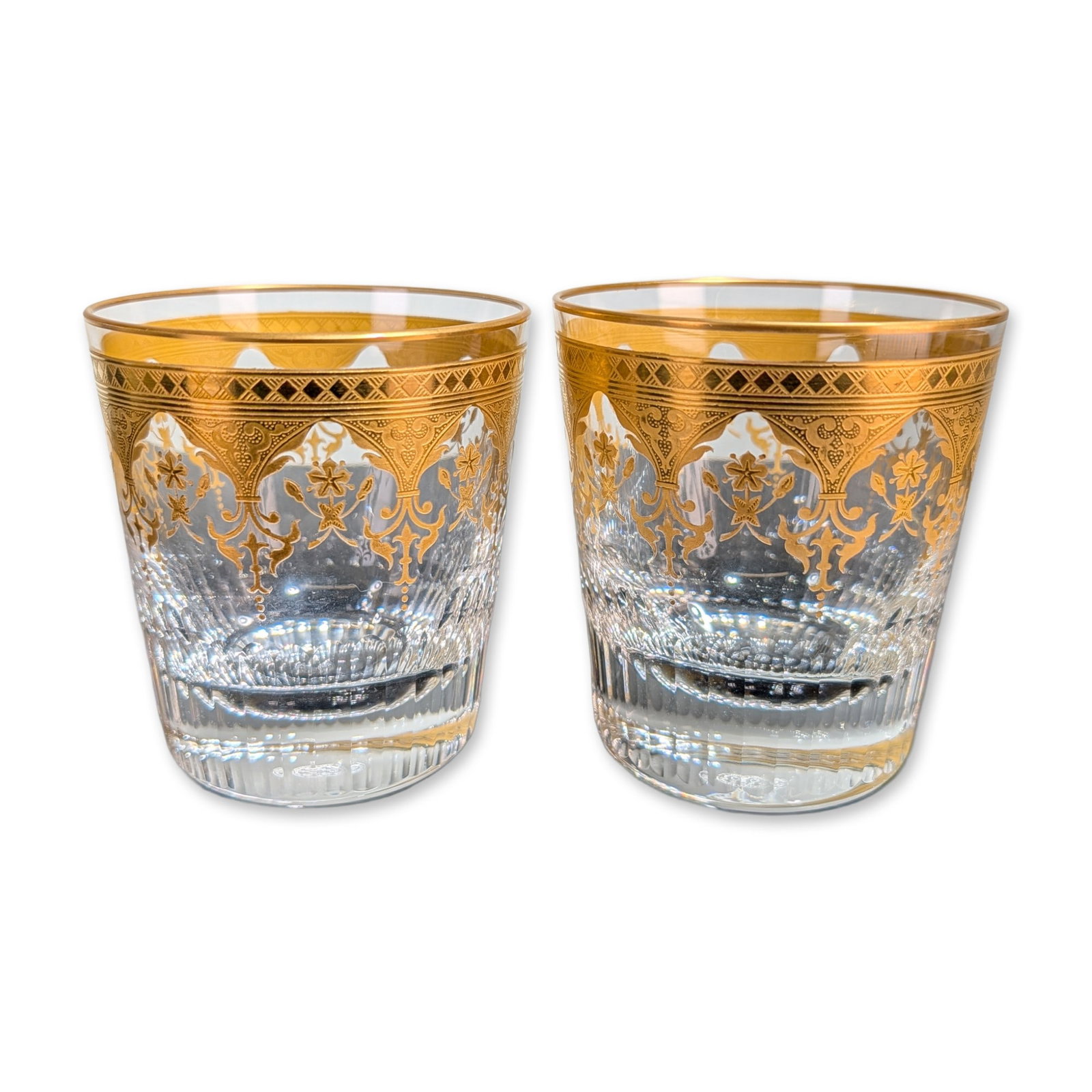 2pc Baccarat France Prestige Gold Encrusted Crystal Tumblers: Baccarat, France, pair of rocks glasses in lead crystal from the Prestige pattern, featuring acid-etched and gold-encrusted decorative borders. Each vessel is decorated with a gilt rim of diamond latt