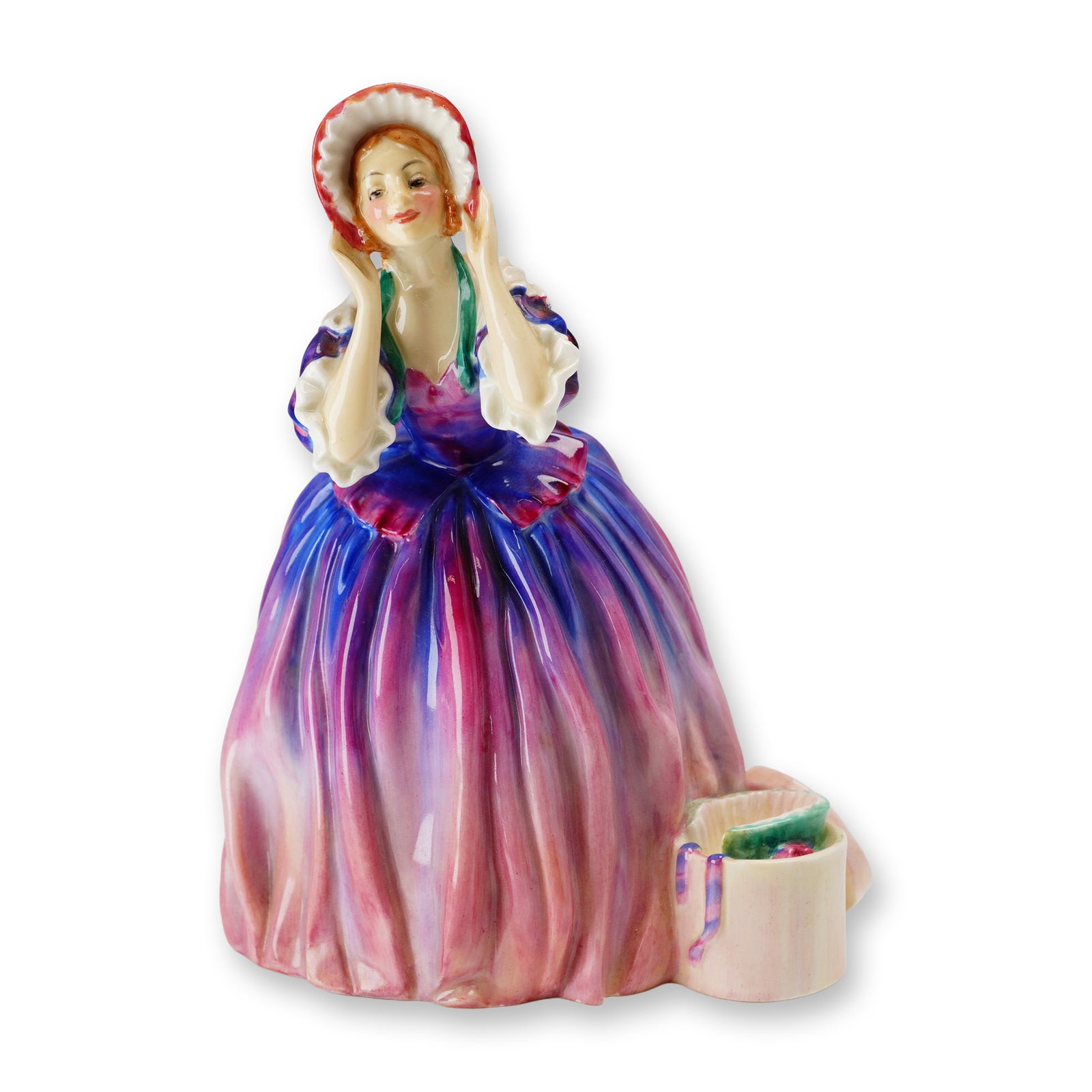 Royal Doulton Bone Chiina Figurine, The Choice HN1960: Design by Leslie Harradine. The polychrome glazed figure depicts a woman in mid-19th-century attire featuring a voluminous skirt with vertical tonal stripes in shades of blue and magenta. The bodice i