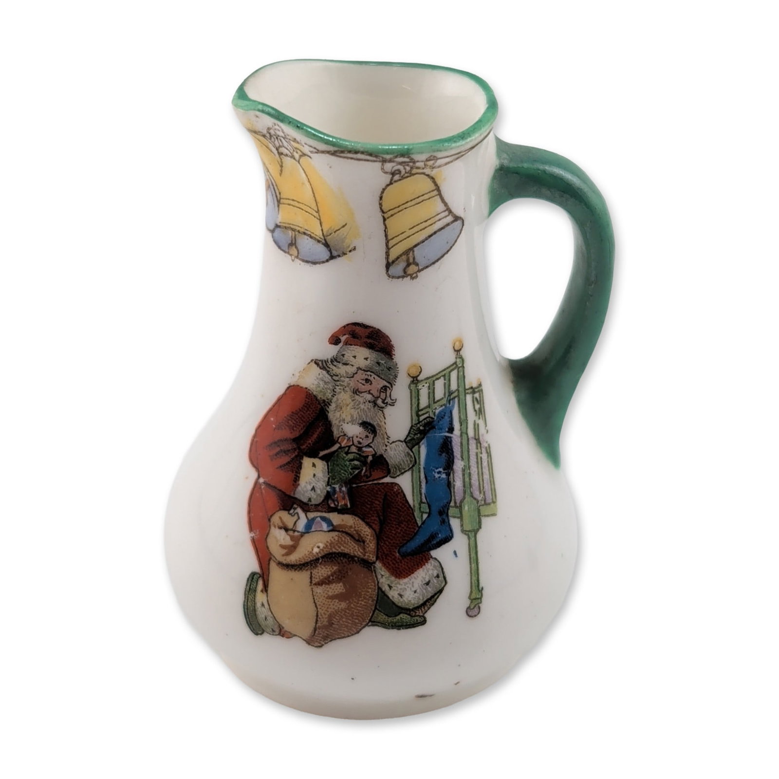 Royal Doulton Christmas Series Ware Miniature Pitcher: Miniature ovoid pitcher in glazed porcelain, featuring festive transfer decorations. The body depicts Santa Claus seated beside a sack of toys with two yellow bells. The reverse bears a light blue scr