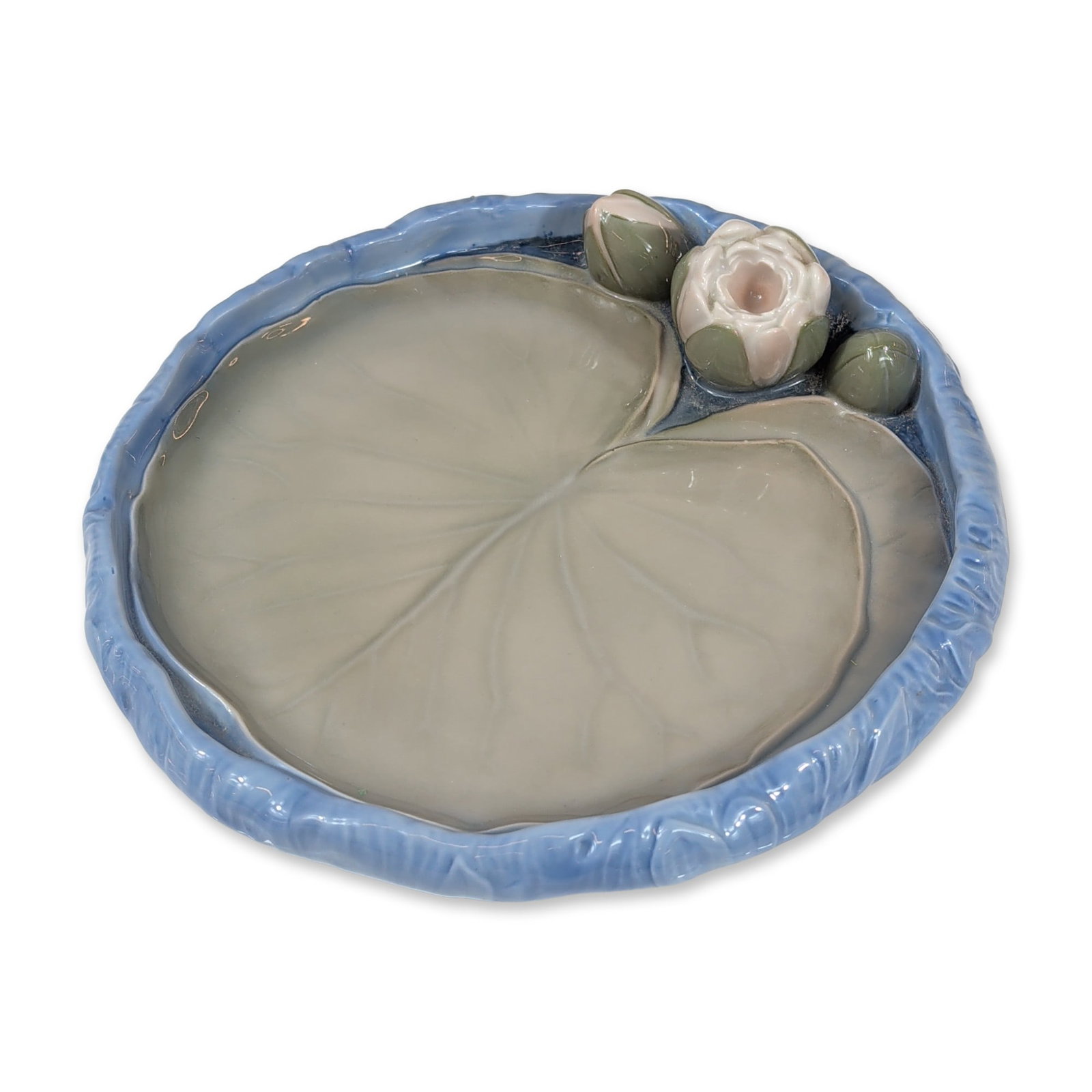 Bing and Grondahl Danish Porcelain Water Lily Dish: Bing and Grondahl, Denmark. Large decorative dish in glazed porcelain, modeled as a lily pad. The interior features a soft grey-green glaze with molded vein details, bordered by a textured rim in vari