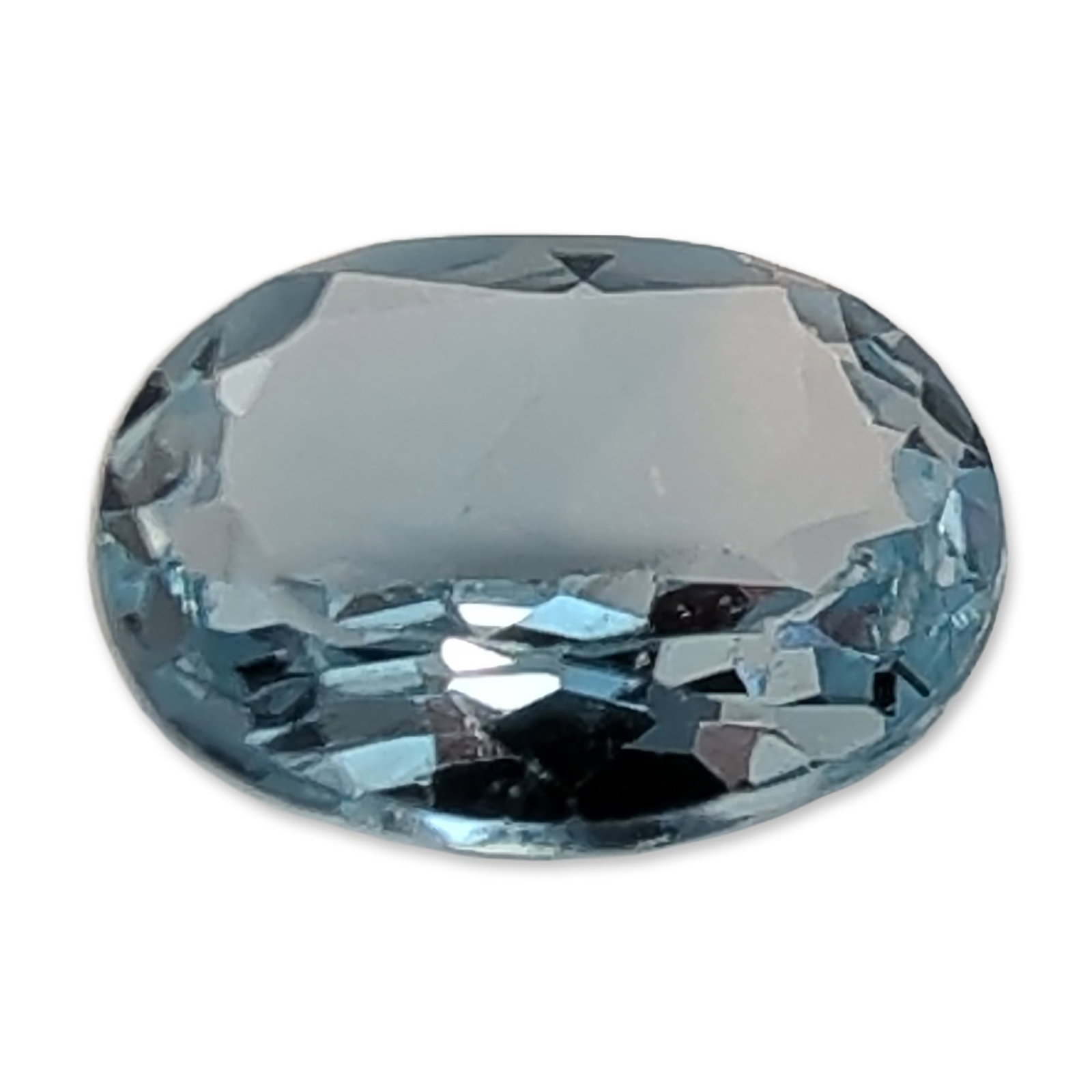 Oval Cut Light Blue Loose Sapphire Gemstone: Loose Sapphire gemstone in an oval brilliant cut. The stone features a transparent light pastel blue color with even distribution. The construction includes a faceted pavilion and a large table facet 