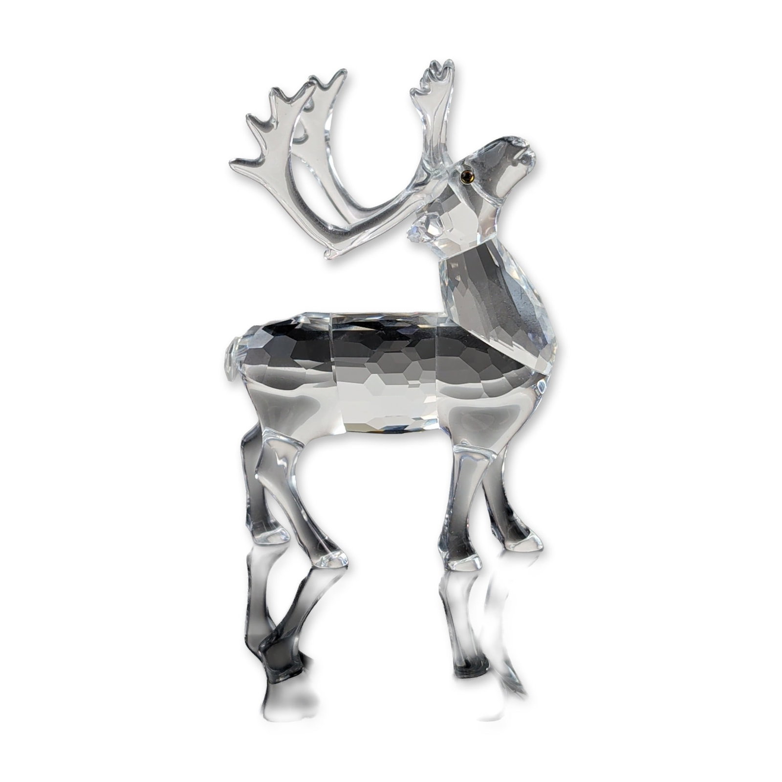 Swarovski Silver Crystal Reindeer Figurine: Swarovski Silver Crystal reindeer figurine crafted in faceted clear lead crystal. The standing figure is depicted with its head held high and features multi-pointed antlers and small, inset Moroda cry