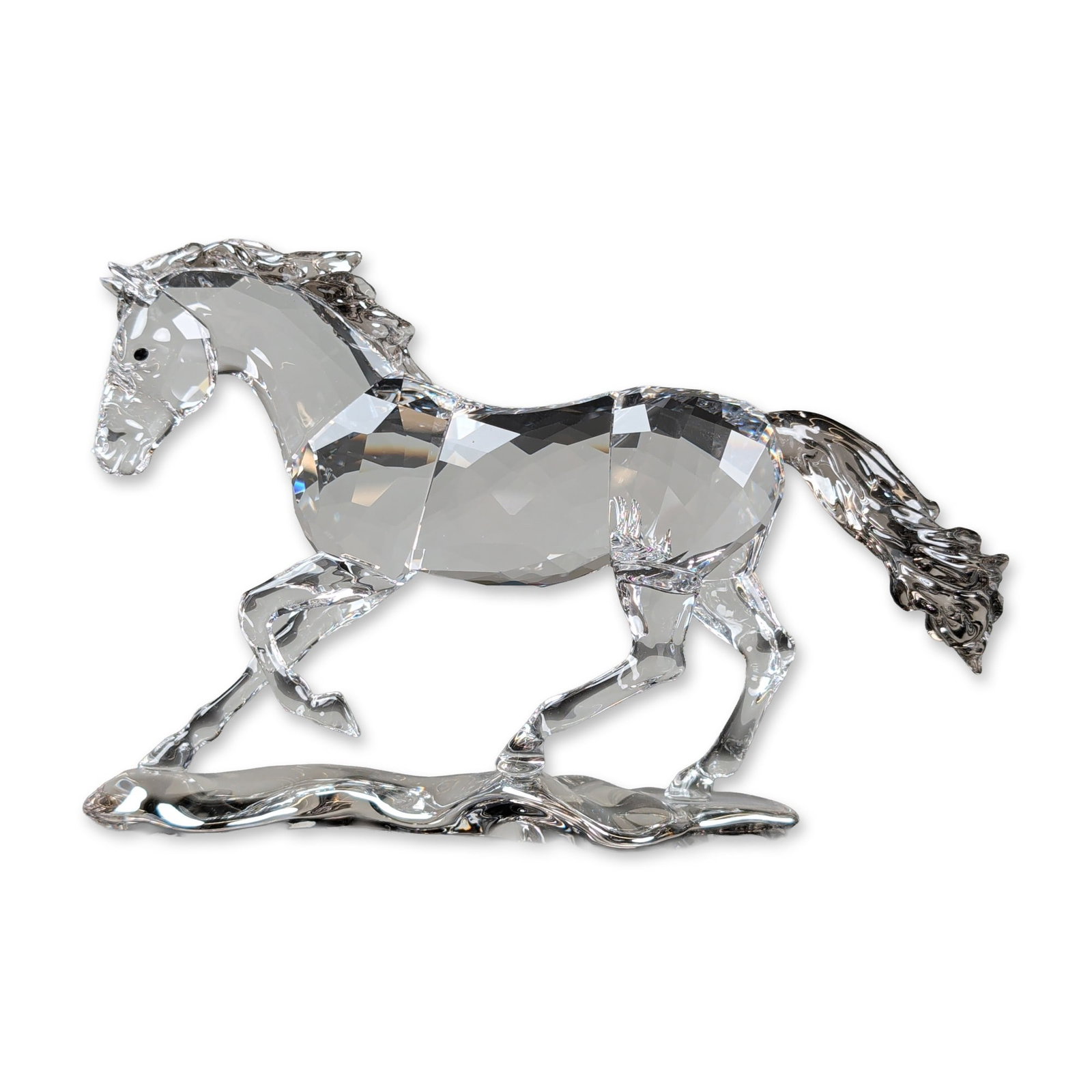 Swarovski Crystal 2014 SCS Annual Edition Figurine, Esperanza Horse: Esperanza horse figurine in clear faceted crystal. The piece depicts a galloping horse atop a stylized clear crystal terrain base, featuring dark crystal eyes and a textured mane and tail. The undersi
