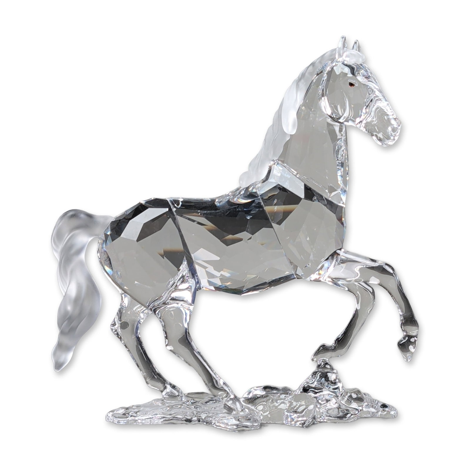 Swarovski Crystal Figurine, Stallion: The piece is constructed of multi-faceted clear lead crystal with a frosted finish mane and tail, standing on a textured crystal base. Includes original blue presentation box with silver branding. Etc