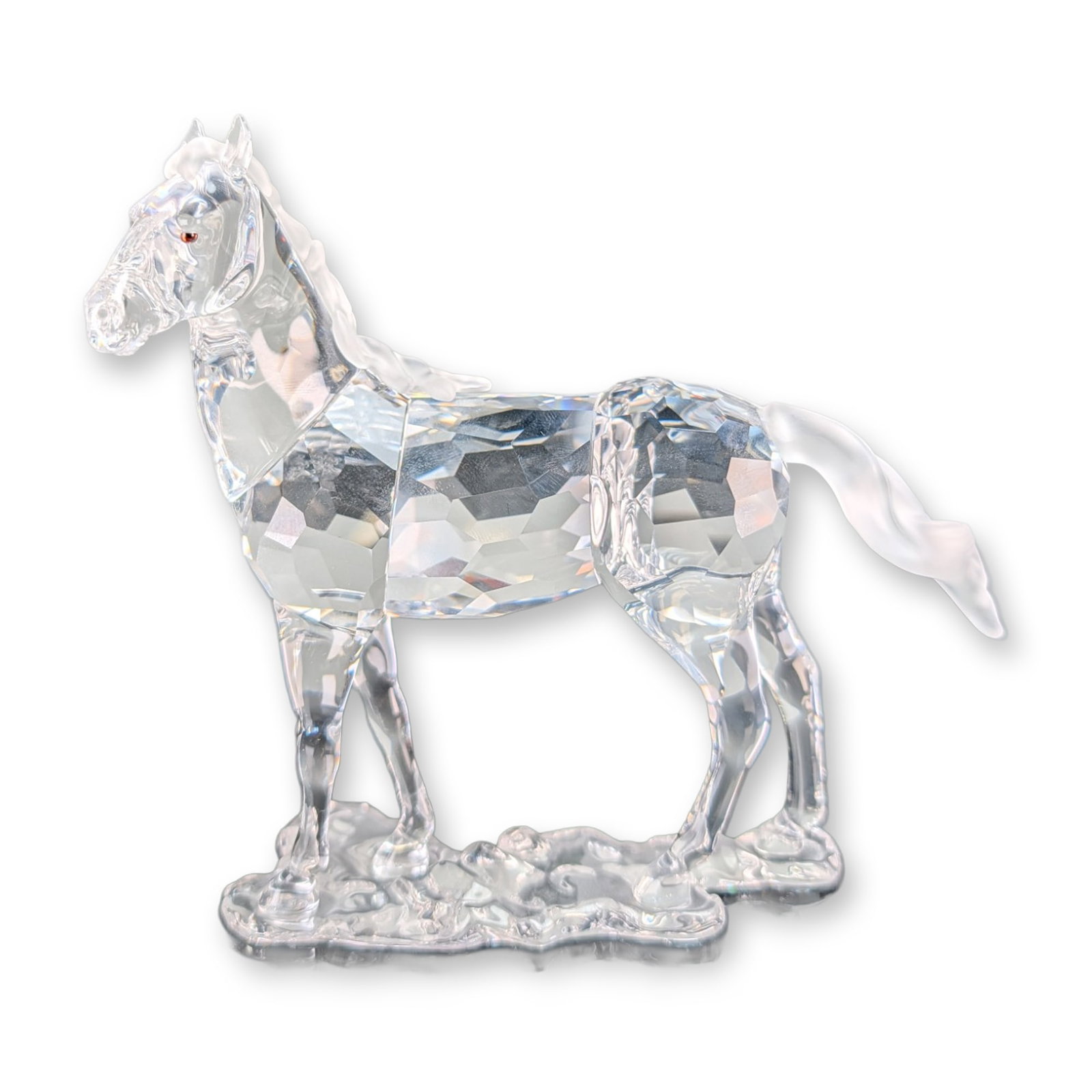 Swarovski Crystal Mare Horse Figurine: Swarovski Mare horse figurine from The Peaceful Countryside collection in faceted clear lead crystal, featuring a frosted mane and tail. Designed by Stefanie Nederegger, the horse is modeled in a natu