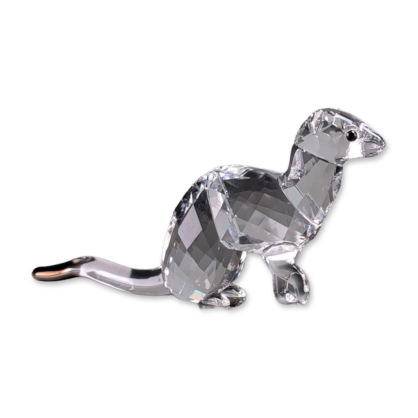 Swarovski SCS Crystal Ermine Figurine: Swarovski 2019 SCS Event Piece lead crystal figurine depicting an ermine modeled in a dynamic pose with a faceted body and head, featuring inset black crystal eyes. The long, curved tail is crafted fr