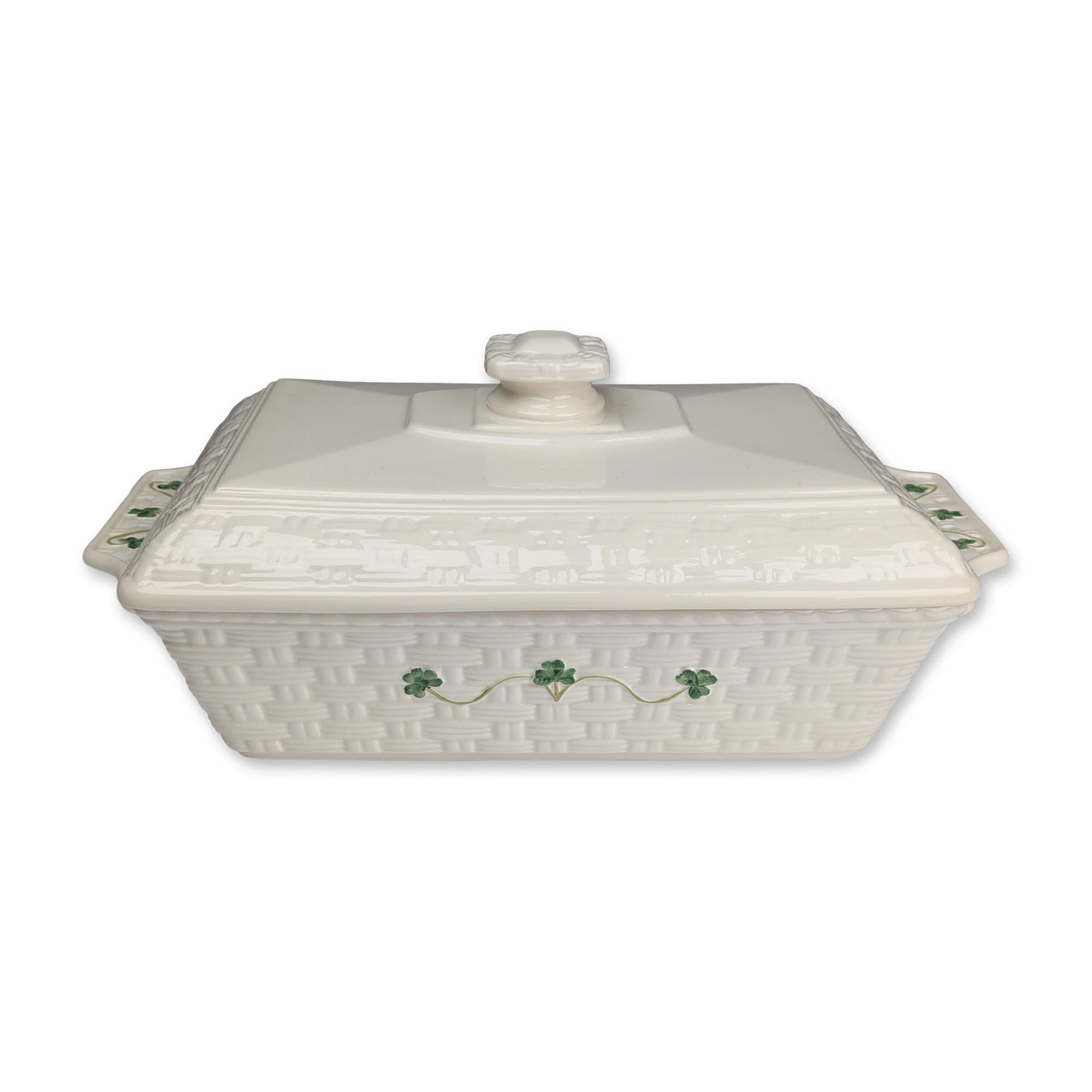Belleek Ireland Everyday Shamrock Rectangular Covered Casserole: Covered rectangular casserole dish in glazed cream earthenware from the Everyday collection, featuring the Shamrock pattern. The body and lid are decorated with an embossed basketweave texture and han
