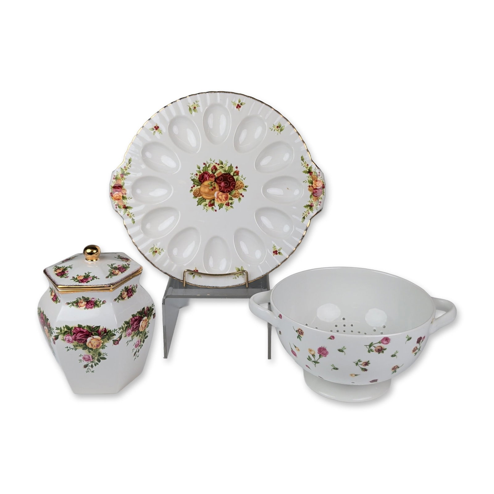 3pc Royal Albert Porcelain Tableware, Old Country Roses: Royal Albert consisting of three decorative serving pieces with signature floral transfers and gold-gilt accents. The group features a hexagonal lidded biscuit jar with a Michael Doulton signature in 