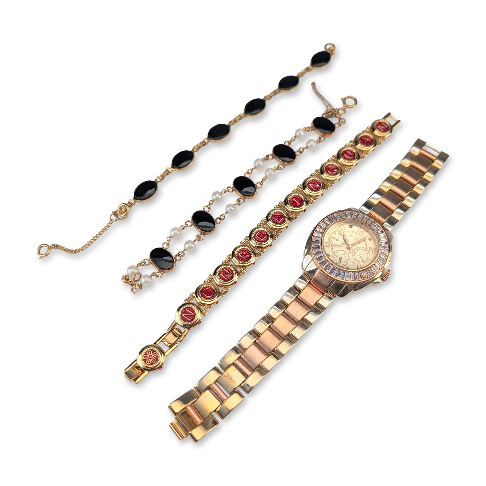4pc Fashion Bracelets and Watch Jewelry Collection: The Heidi Klum Wildlife series wristwatch features a multi-tone metal link bracelet and a bezel set with clear baguette-cut crystals surrounding a champagne dial with three subdials. The case back is 
