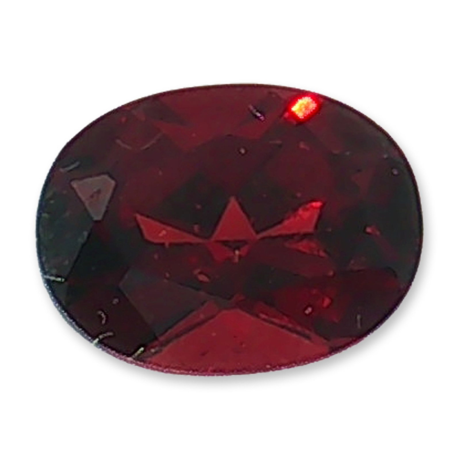 Oval Cut Loose Red Spinel Gemstone: Loose faceted gemstone appears to be a red spinel, featuring a classic oval cut and a deep, rich red color with subtle variations in its dark crimson hue. The faceted surface allows light to interact 