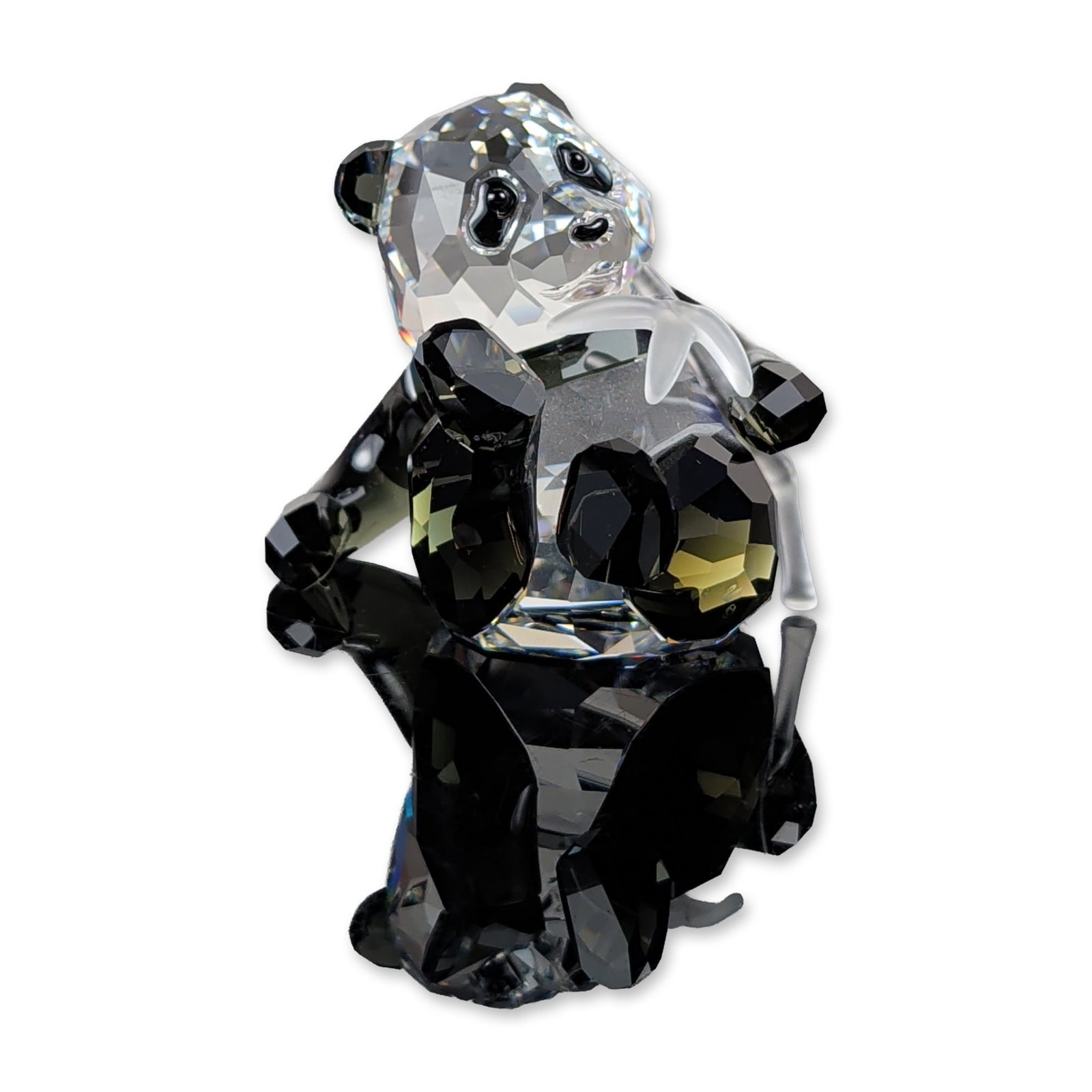Swarovski SCS 2008 Panda Cub Crystal Figurine: Swarovski Crystal Society (SCS) 2008 Annual Edition. Constructed in faceted clear crystal with jet black crystal ears, eyes, and limbs. The figure is modeled holding a frosted matte crystal bamboo sta