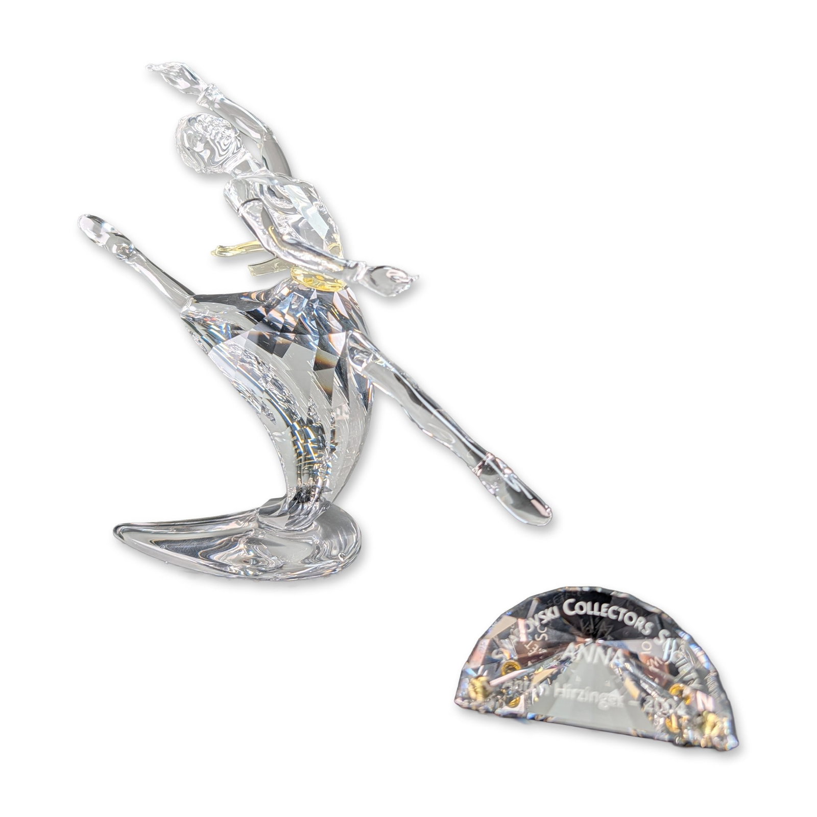 2pc Swarovski SCS 2004 Anna Crystal Figurine w/ Crystal Title Plaque: Swarovski Collectors Society 2004 Annual Edition crystal figurine titled Anna, the final piece in the Magic of Dance trilogy. Designed by Anton Hirzinger, the ballerina is modeled in a dynamic pose, f