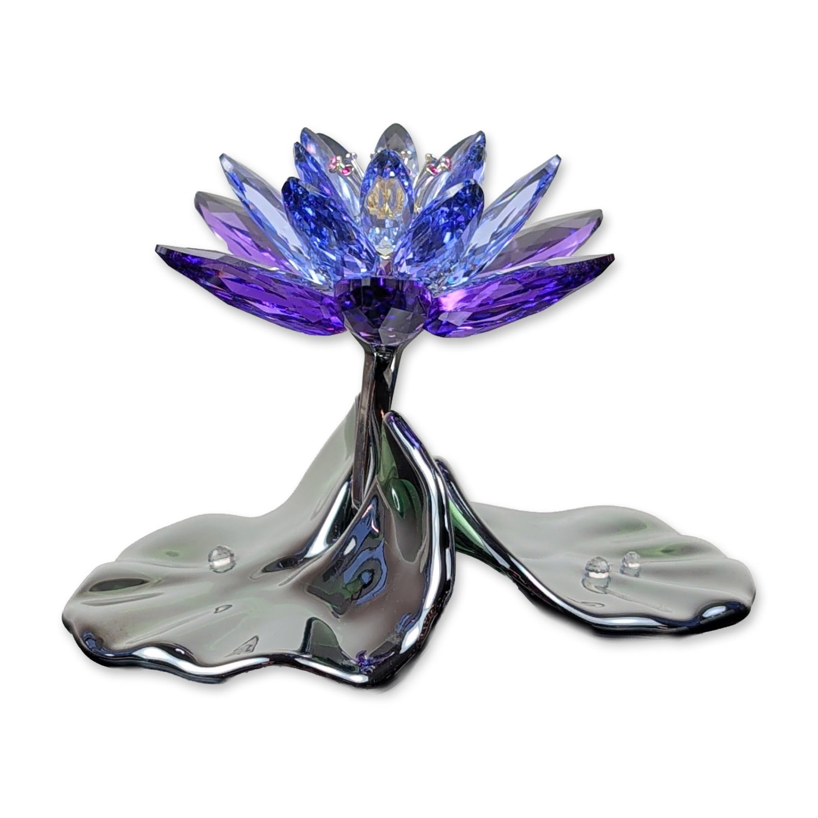 Swarovski Paradise Blue Violet Waterlily Crystal Figurine: Swarovski. Crystal figurine from the Paradise collection, modeled as a water lily (item 1141630). The piece features a central blossom with faceted crystal petals in graduating shades of violet-purple