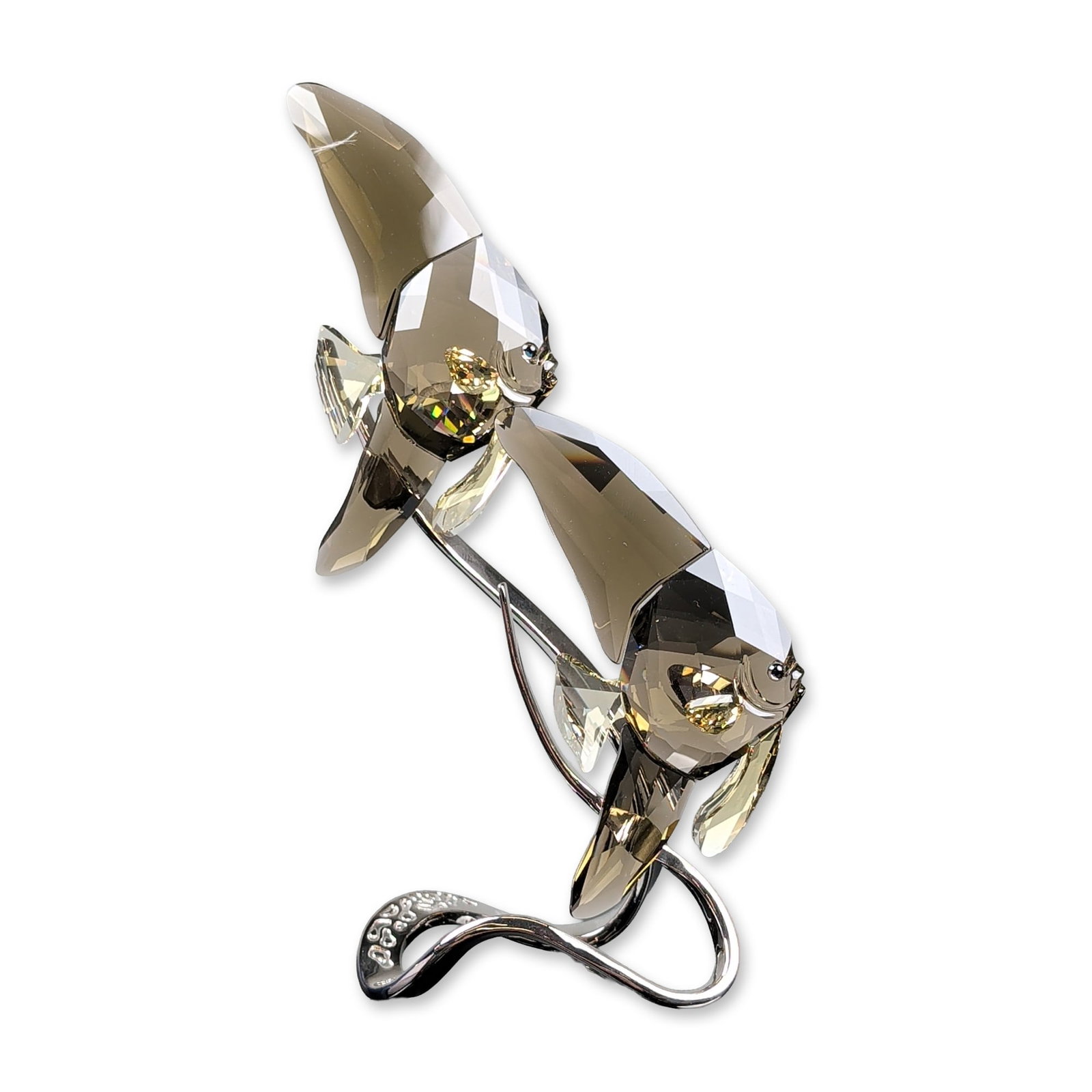 Swarovski Crystal Paradise Fish Figurine, Smoky Quartz Batfish: Swarovski Paradise collection batfish figurine featuring two stylized fish on a sinuous rhodium-plated metal stand. The fish are composed of faceted lead crystal in smoky quartz and jonquil fins accen