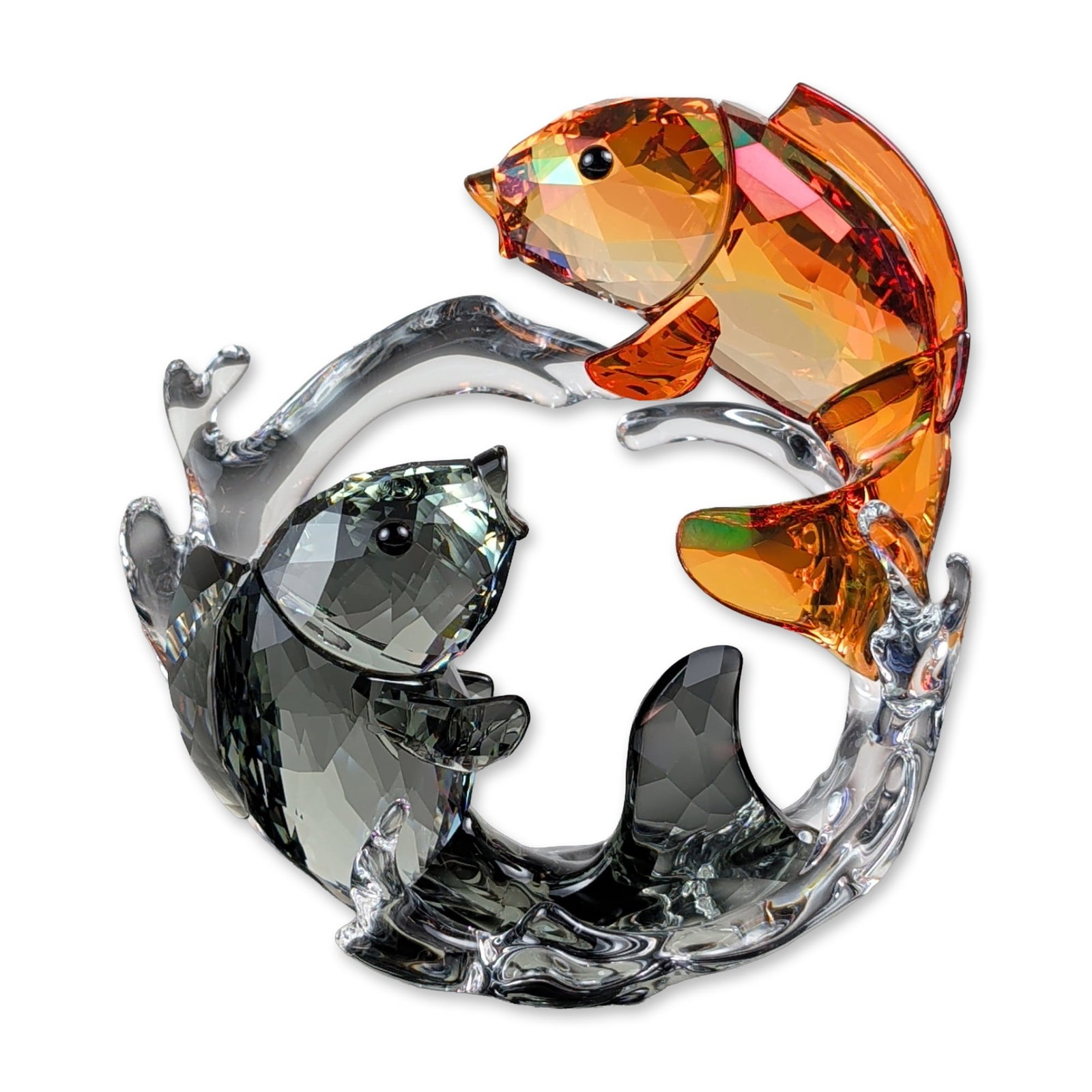 Swarovski Double Carps Crystal Figurine: Swarovski. Asian Symbols collection figurine titled Double Carps, model number 5376621. The piece is composed of faceted crystal, featuring two koi fish swimming in a circular formation among clear cr