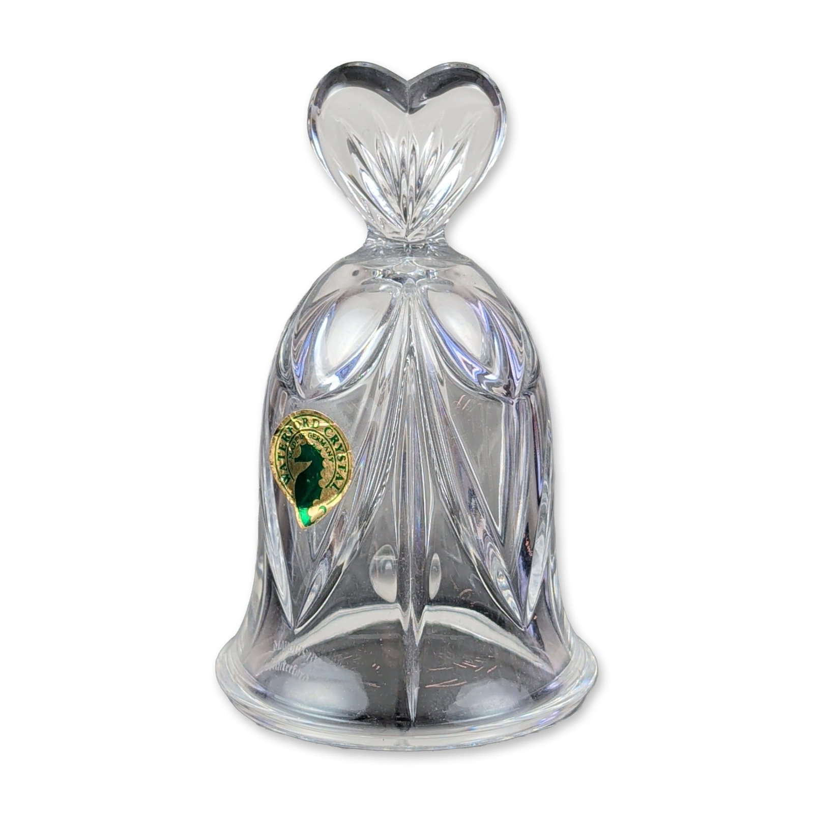 Marquis by Waterford Crystal Heart Hand Bell: Marquis by Waterford crystal hand bell featuring a body decorated with vertical wedge cuts and fan motifs. The bell is topped with a double-heart shaped handle with radiating cuts and contains a clear