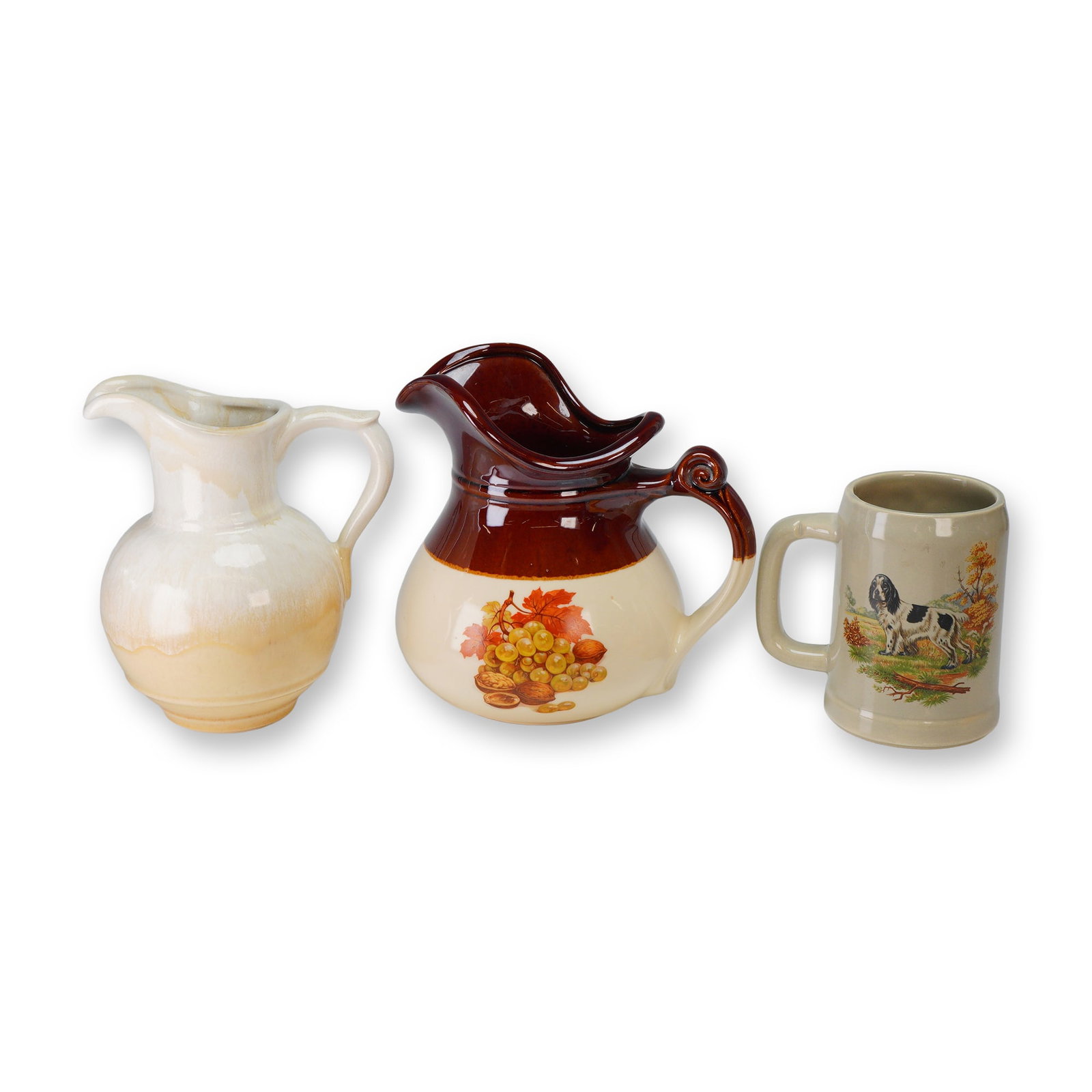 3pc McCoy Pitchers and Mug: A collection of three American glazed ceramic vessels produced by McCoy Pottery (Nelson McCoy Pottery Co.). The group includes a small bulbous pitcher featuring a two-tone cream and pale yellow drip g