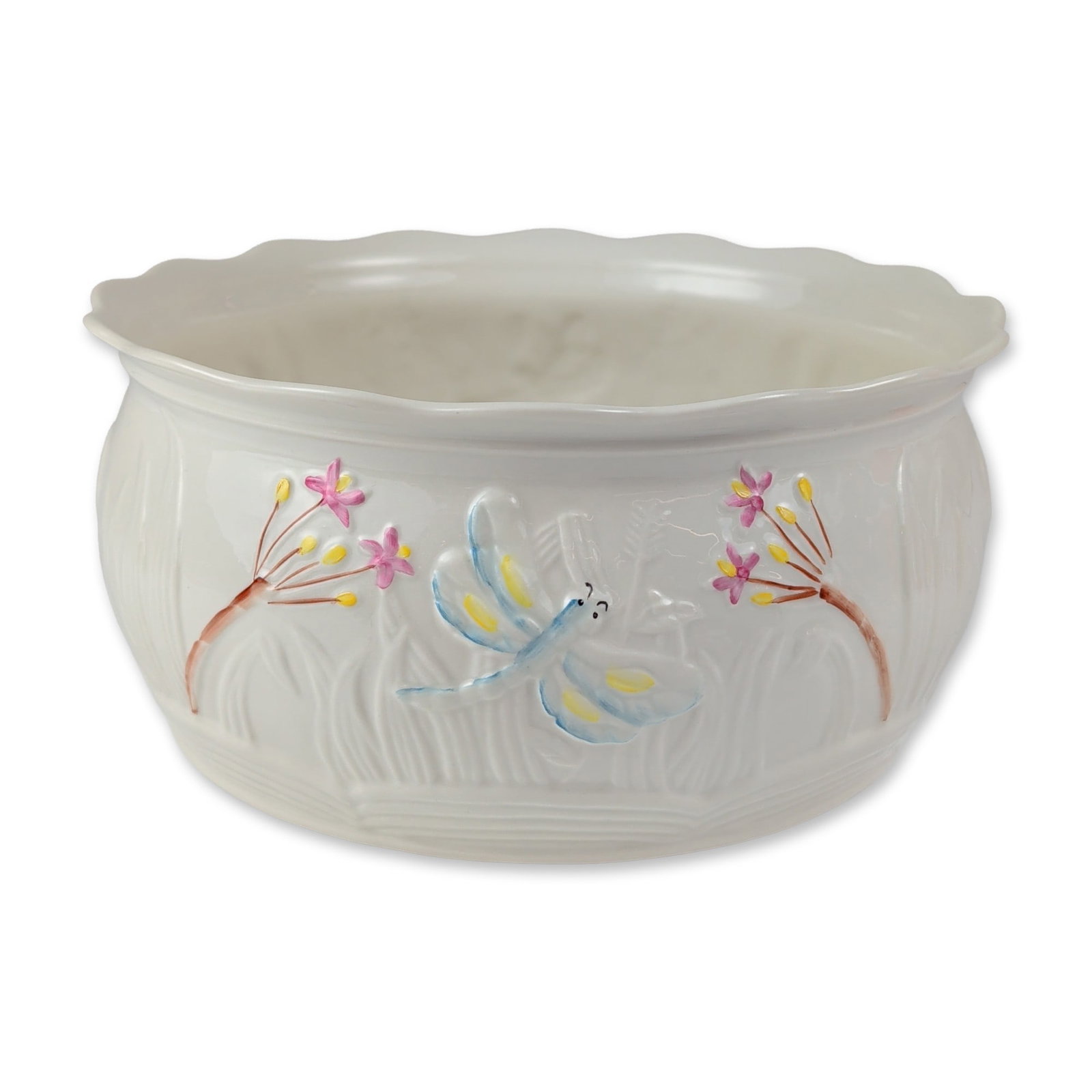 Belleek Irish Parian Porcelain Dragonfly Bowl: Belleek, Ireland. Large round bowl in fine parian porcelain, featuring the relief-molded Dragonfly and Reeds pattern. The exterior is decorated with hand-painted enamel motifs of a blue and yellow dra