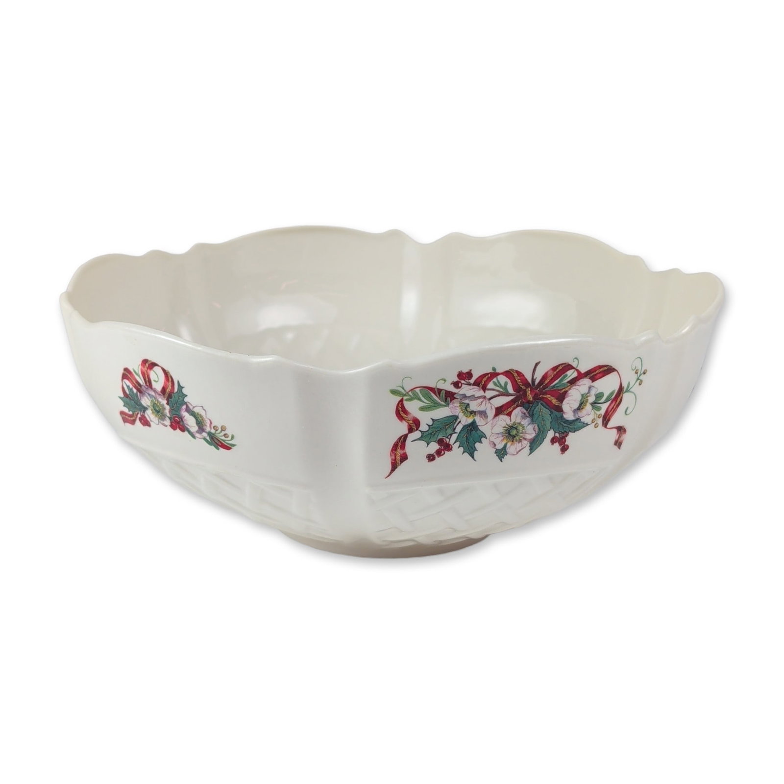 Belleek Winter Rose Parian Centerpiece Bowl: Belleek Irish Parian china centerpiece bowl in the Winter Rose pattern. The circular form features a molded basketweave body with a flared, scalloped rim. Decorated with transfer-printed holiday motif