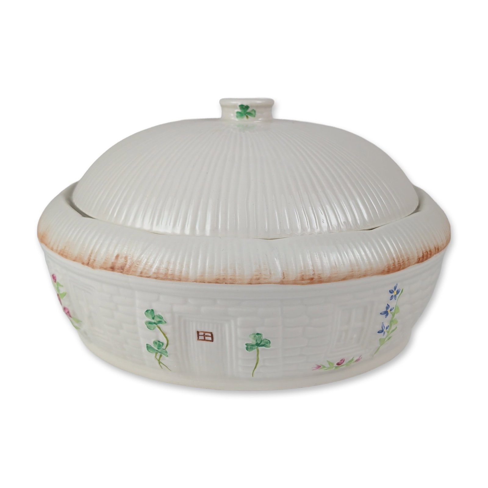 Belleek Ireland Shamrock Covered Casserole: Belleek Pottery, Ireland. Round covered casserole dish in fine parian porcelain, featuring the Shamrock pattern. The piece comprises a high-domed ribbed lid with a knob handle decorated with a single 