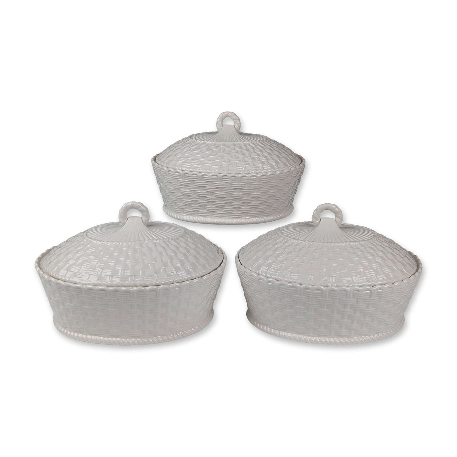 3pc Belleek Ireland Basketweave Covered Casserole Tableware: Trio of oval covered serving dishes from the Everyday collection in white glazed ceramic. Each piece features a relief-molded basketweave pattern throughout the body and lid, accented by a rope-twist 