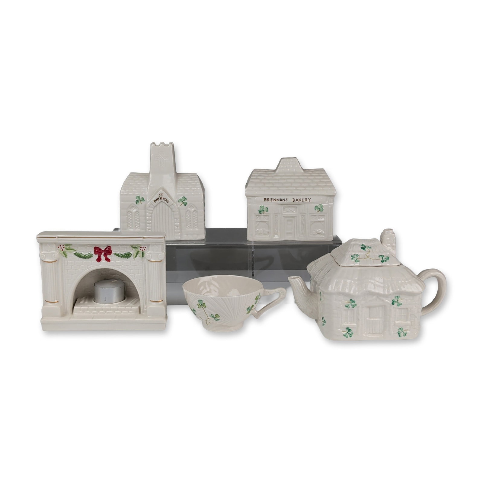 5pc Belleek Ireland Parian Shamrock Porcelain Tealight Holders, Teapot and Cup: Belleek Pottery, Ireland. Group of parian items in cream colored porcelain with molded and hand-painted details. The collection includes a teapot in the Shamrock pattern with cottage-style lid, a coor