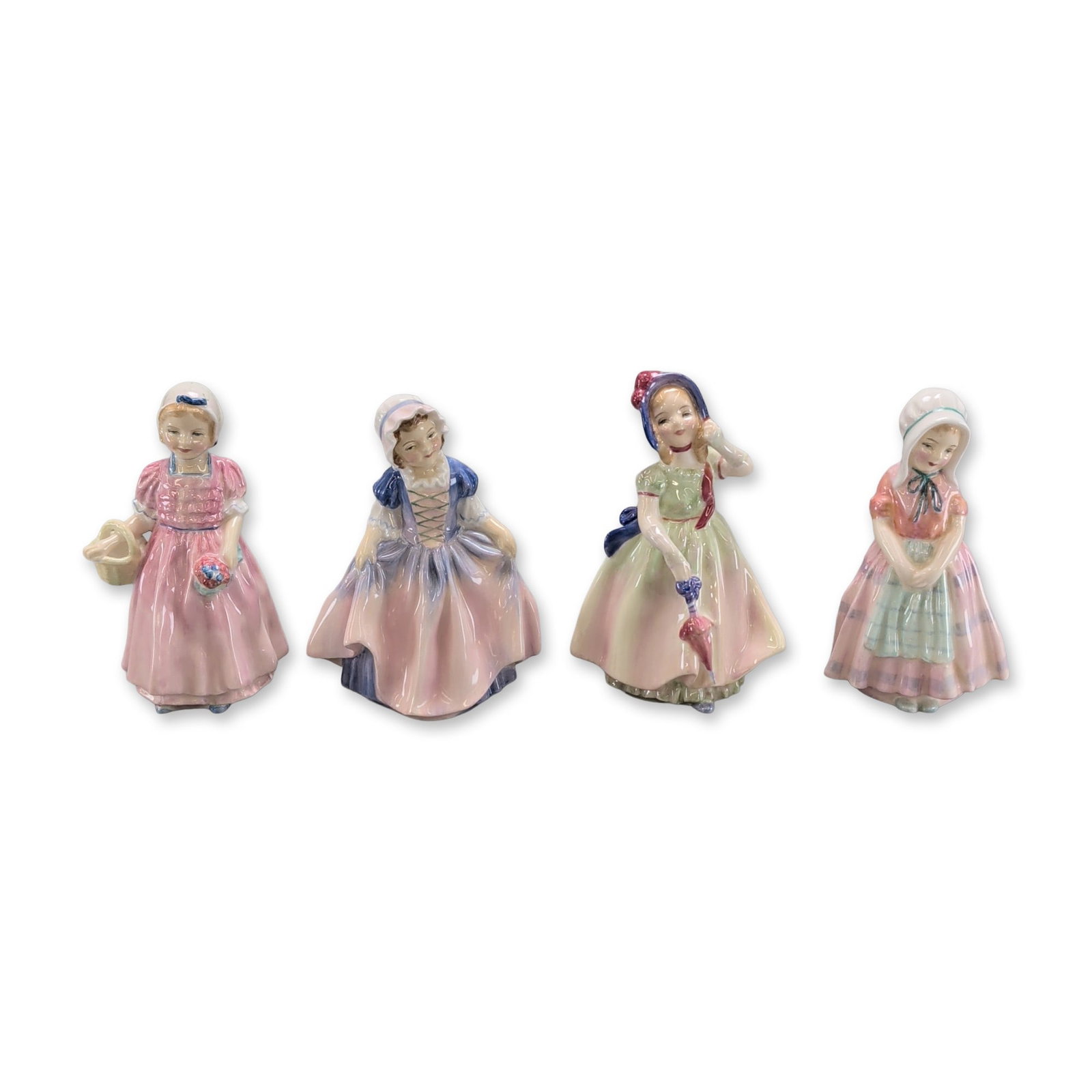 4pc Royal Doulton Figurines,: Royal Doulton collection of four glazed porcelain figurines from the HN series, each depicting a young girl in a varied costume. The set comprises models titled Tootles (HN 1680), Babie (HN 1679), Din