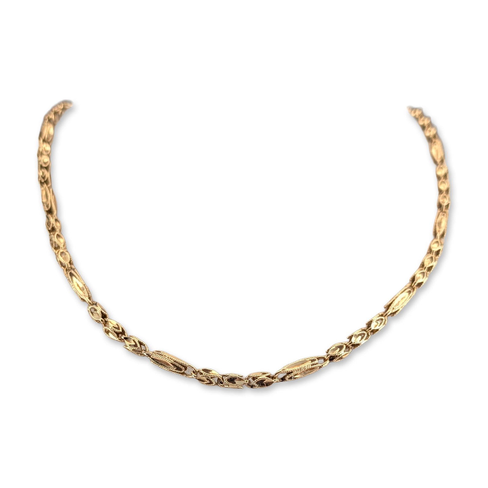 14K Yellow Gold Fancy Link Necklace: 14k yellow gold fancy link necklace, featuring a repeating pattern of textured elongated oval links with polished borders joined by circular textured spacers. The piece is secured with a box clasp and