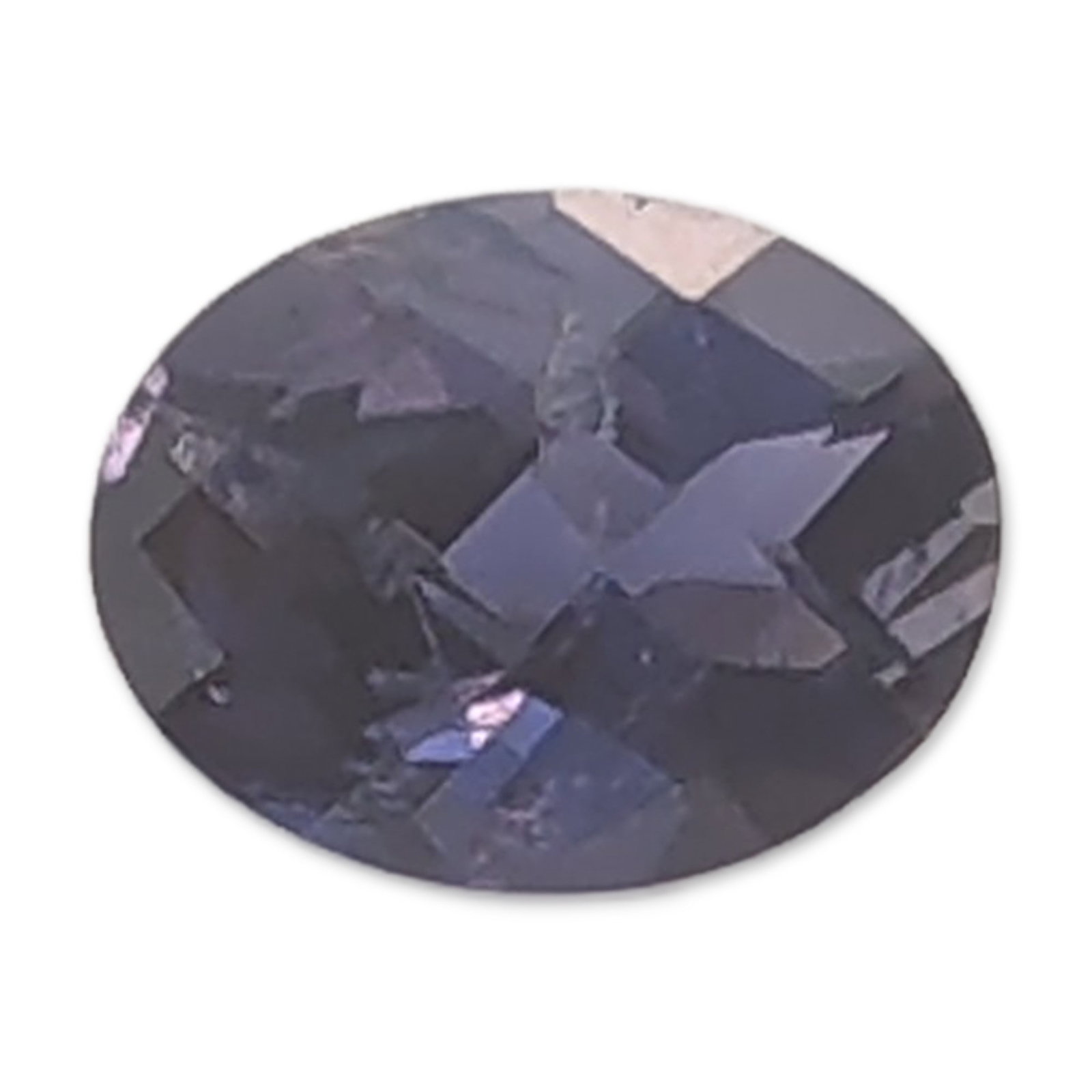Oval Faceted Deep Violet-Blue Tanzanite Gemstone: Loose faceted tanzanite gemstone featuring an oval faceted cut in a deep violet-blue color with grayish undertones. The stone exhibits an eye-clean appearance. Weight: 0.9 ctLength: 7.9 mm. Dimensions