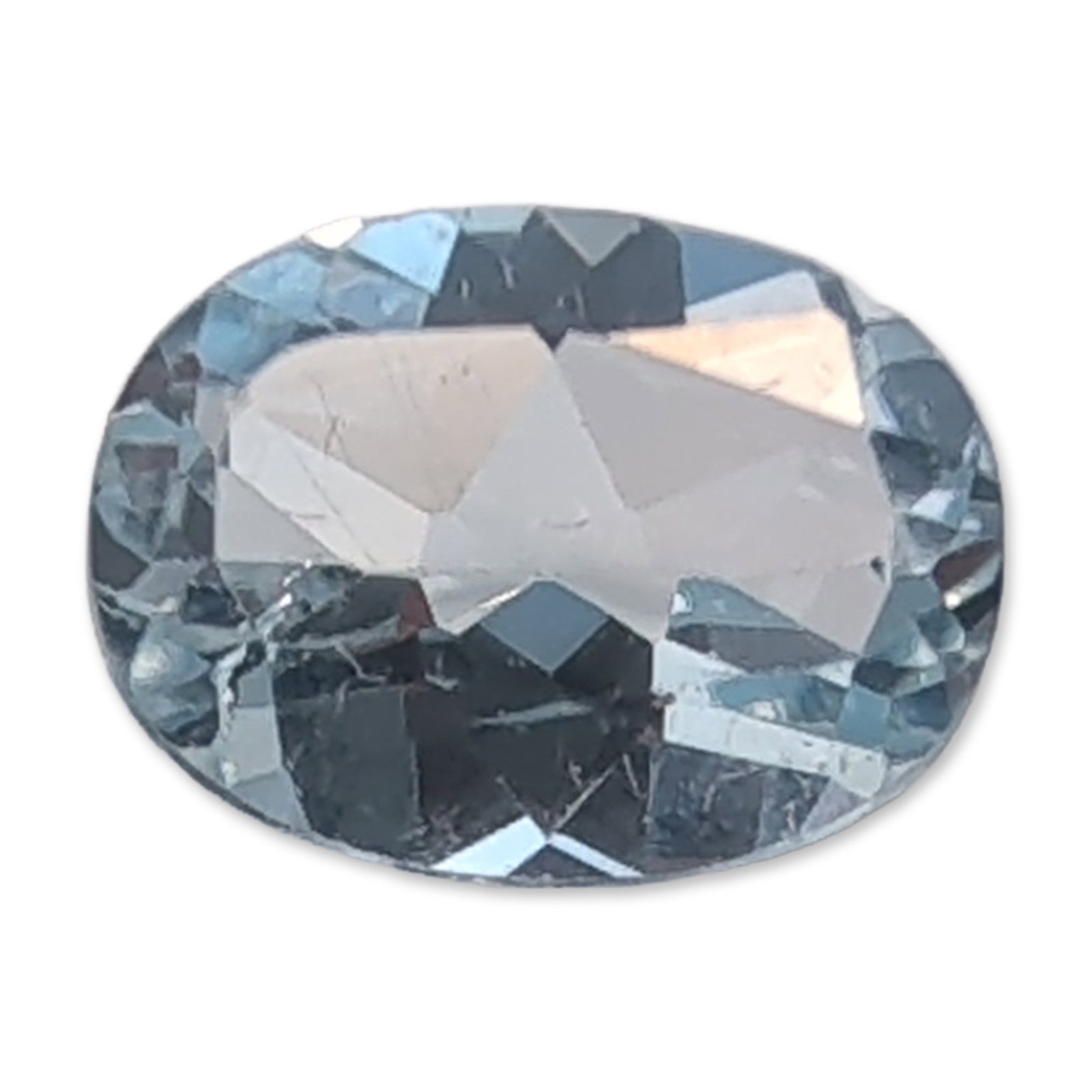 Loose Oval Faceted Blue Topaz Gemstone: A loose blue topaz gemstone. The stone features an oval faceted cut and exhibits a pale blue color. Internal characteristics include visible feathers and fractures.Weight: Approximately 1.3 caratsLeng