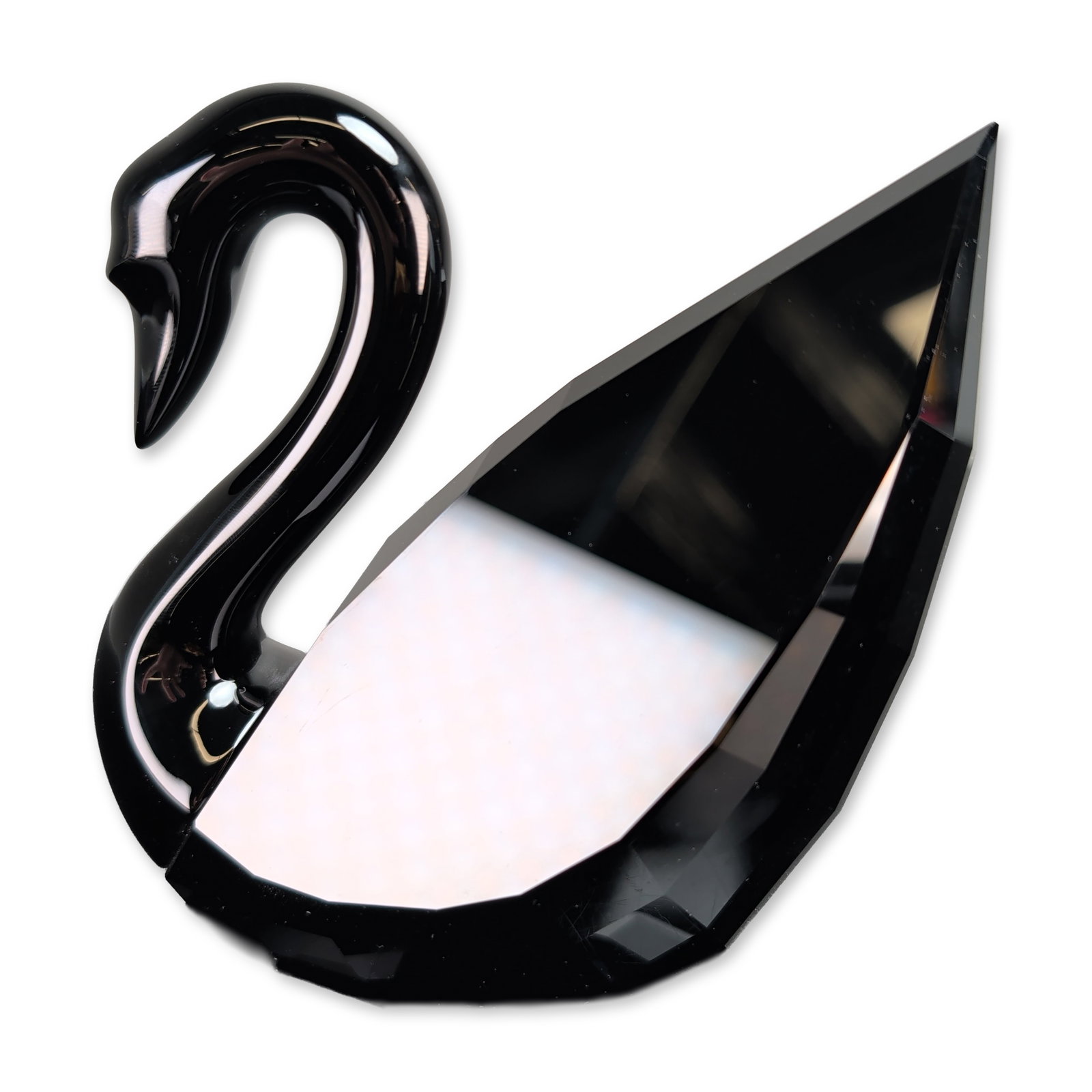 Swarovski Jet Black Crystal Soulmates Swan Figurine: Swarovski Soulmates collection swan figurine in faceted black Jet crystal. Designed by master artist Anton Hirzinger, it features a minimalist curved neck and geometric faceted body. Acid-etched Swaro