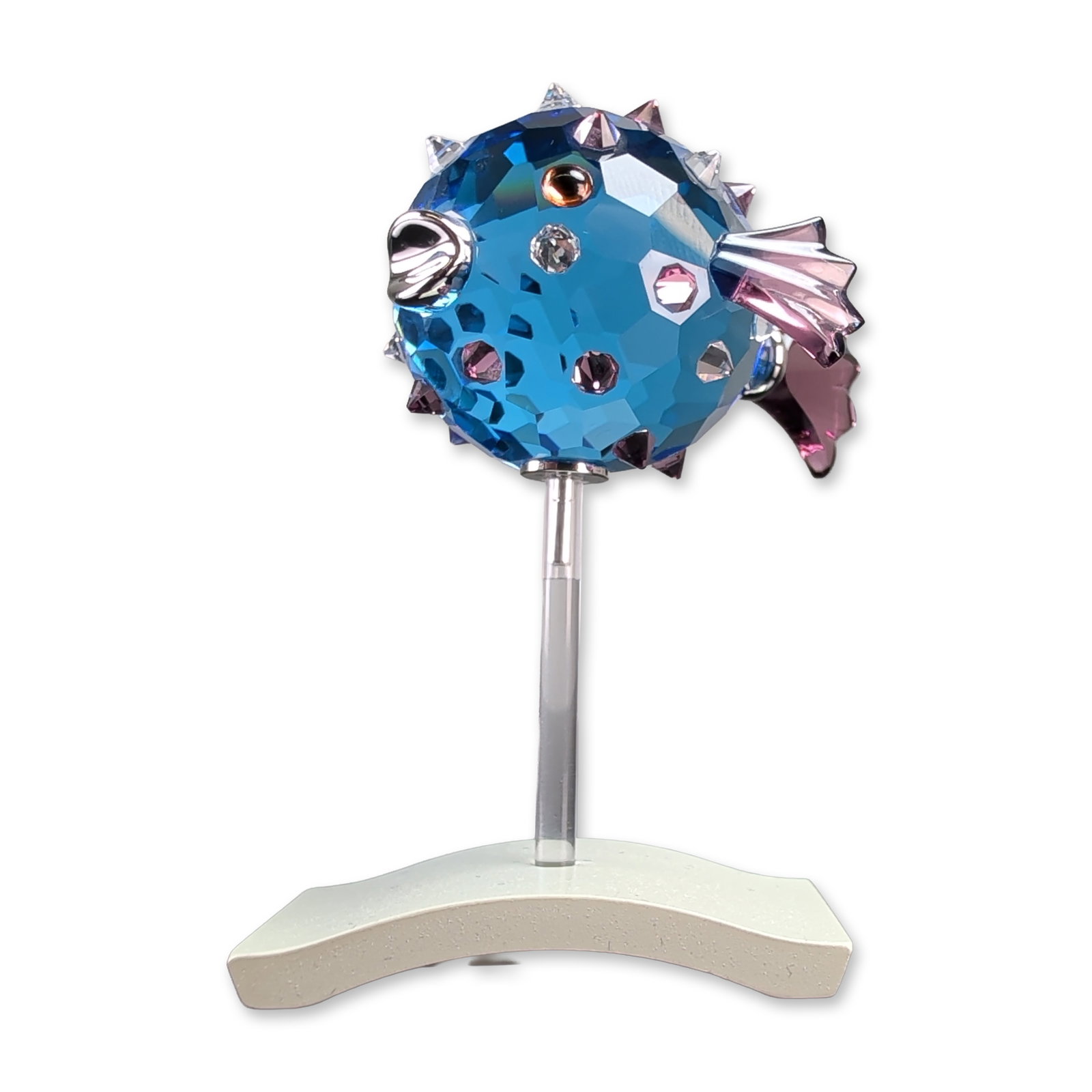 Swarovski Paradise Cleona Capri Blue Crystal Puffer Fish: Swarovski Paradise series puffer fish figurine in Capri blue faceted crystal. The spherical body features purple crystal spikes and fins, a metallic mouth, and dark crystal eyes. Includes original Swa