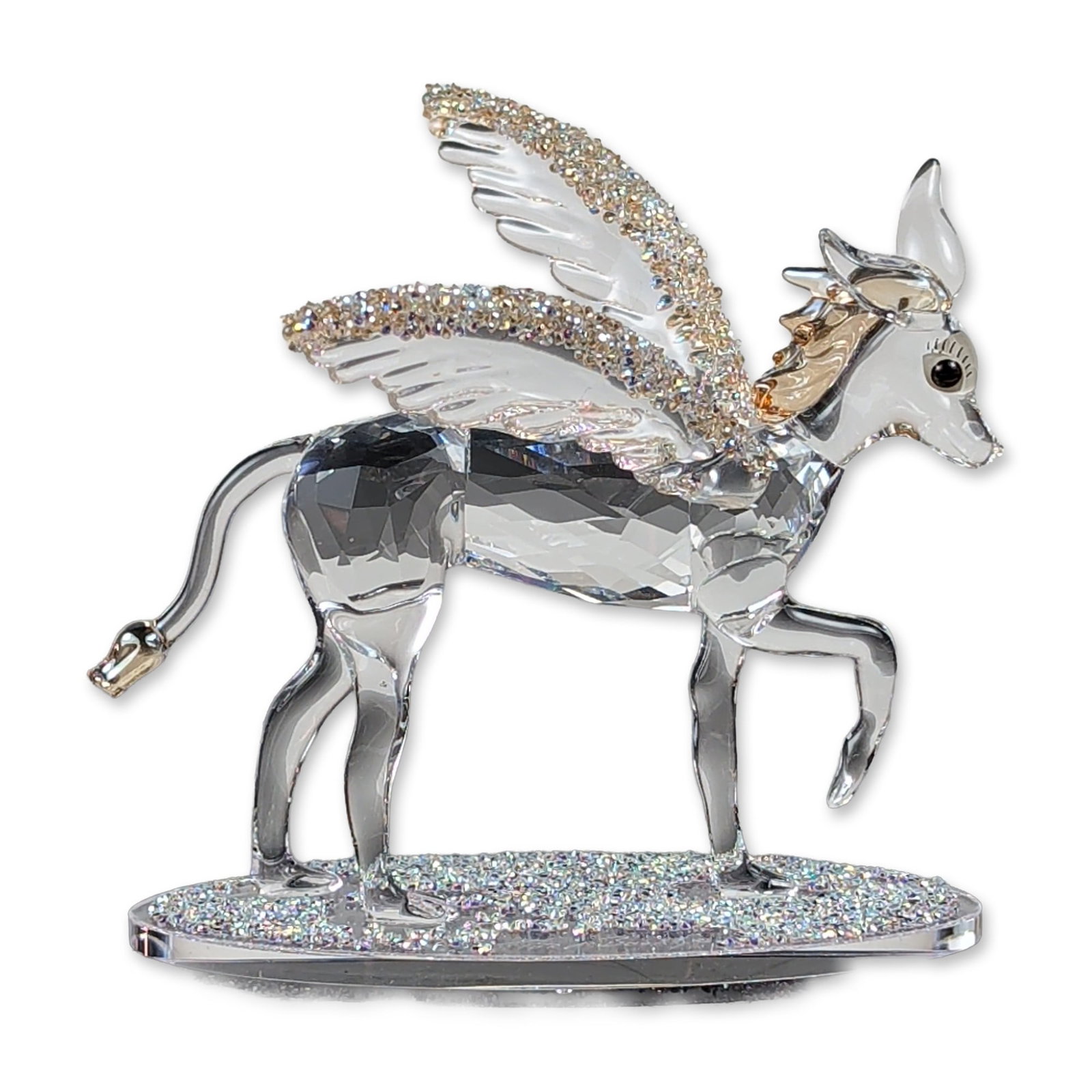 Swarovski Tord Boontje Grazelle Crystal Figurine: Swarovski limited edition Grazelle crystal figurine, designed by Tord Boontje. The faceted clear lead crystal figure depicts a winged deer in a prancing pose. The wings and a portion of the oval base 