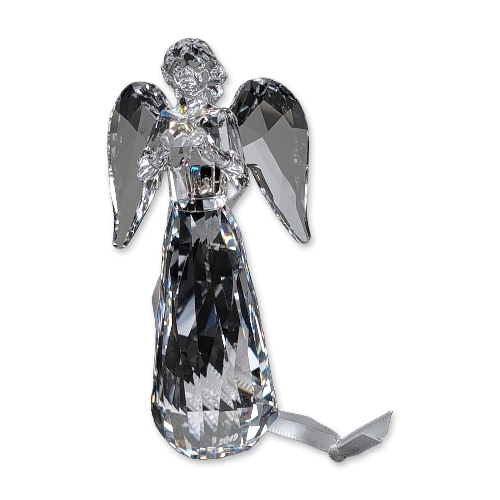 Swarovski Crystal 2019 Annual Edition Angel Ornament: Swarovski Annual Edition 2019 angel ornament in faceted clear lead crystal. The stylized figure is designed with a multifaceted gown, outstretched wings, and a textured head, holding a small faceted c