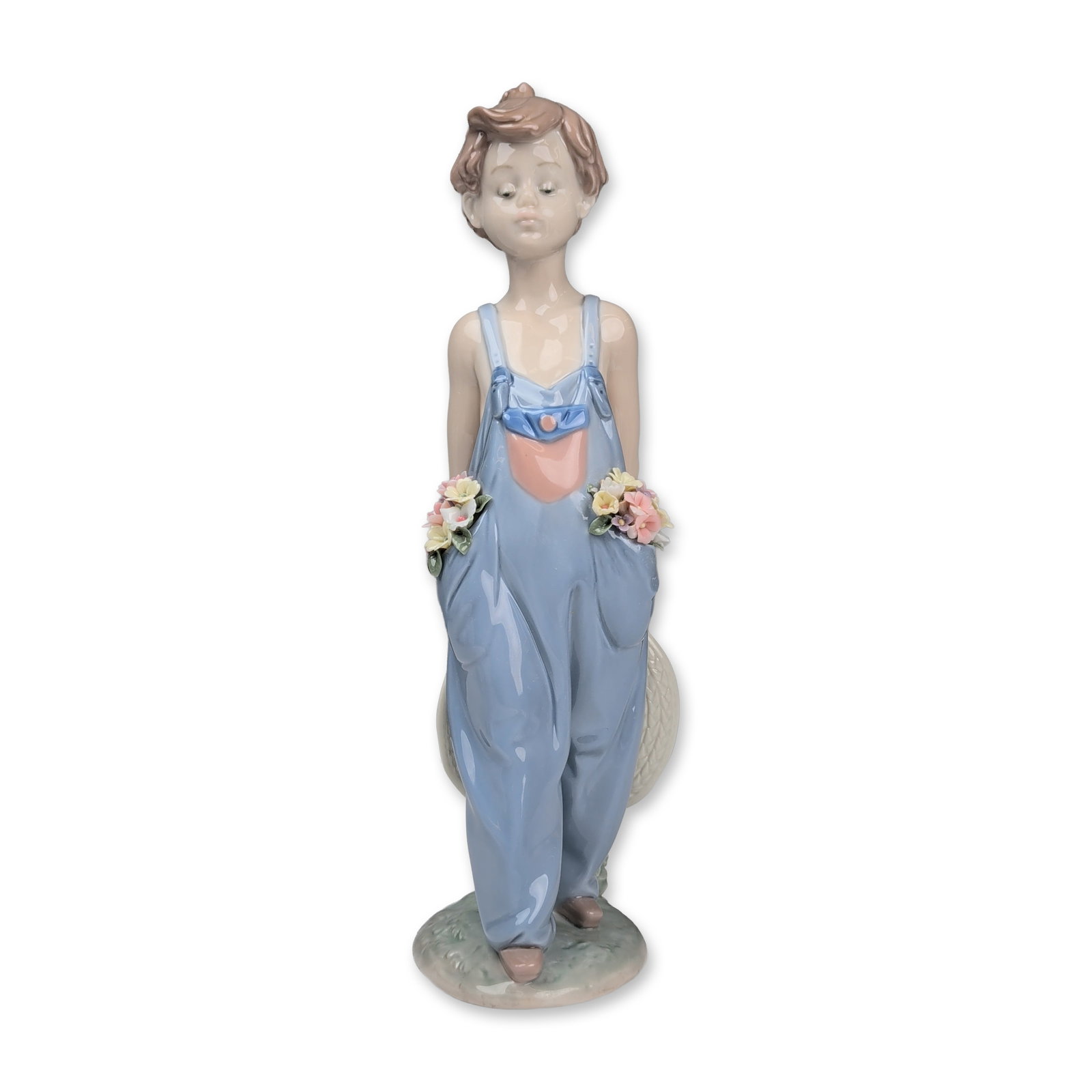 Lladro Porcelain Figurine, Pocket Full of Wishes 01007650: Lladro Spanish glazed porcelain figurine titled Pocket Full of Wishes, model number 7650. The piece depicts a young girl in light blue overalls with crossed straps at the back, featuring hand-applied 
