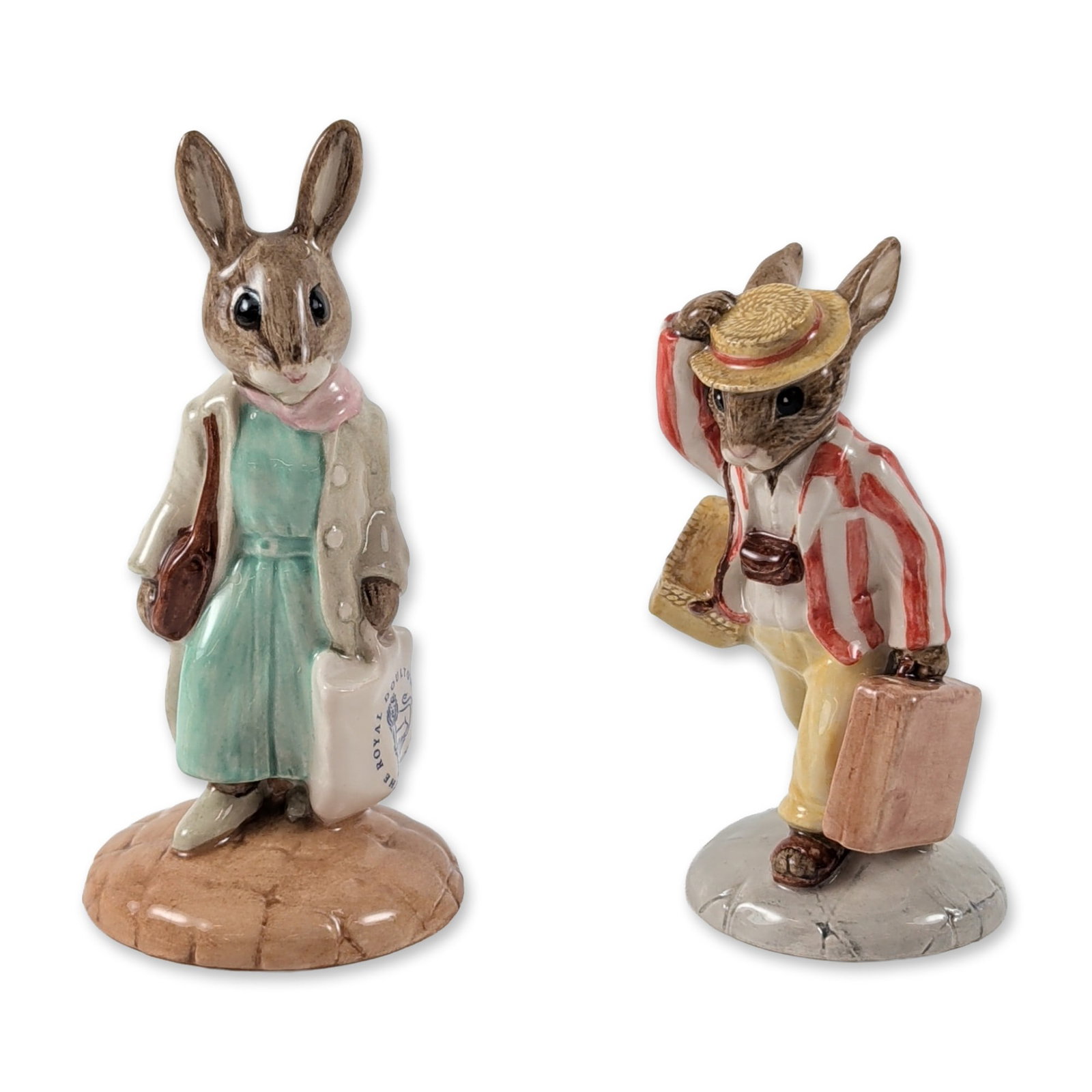 2pc Royal Doulton Bunnykins Figurines: Royal Doulton, England. Two figurines in glazed porcelain from the Bunnykins collection. The lot includes Father Bunnykins (DB 154) modeled in a striped blazer and boater hat, and Shopper Bunnykins (D