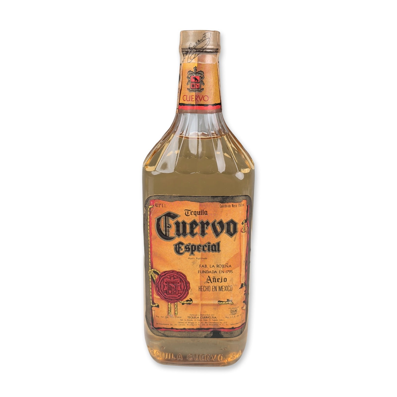 Jose Cuervo Especial 1970s A?ejo Tequila Bottle: Mexican, circa 1970s. Jose Cuervo Especial A?ejo tequila in a 750 ml fluted glass bottle. Features a primary paper label designed as a faux-parchment scroll, displaying the DGN mark and 43.5 degrees G