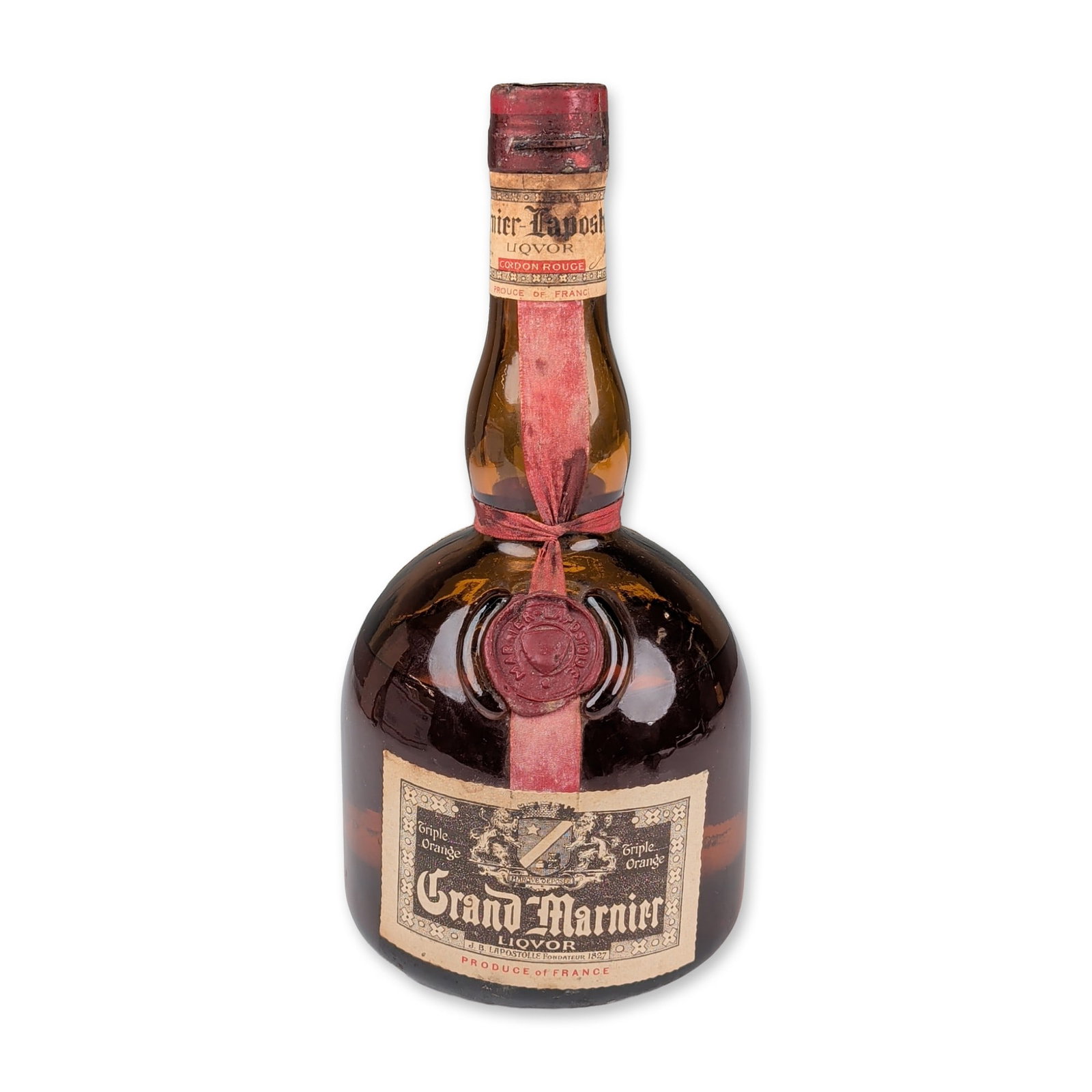 Grand Marnier Liqueur Cordon Rouge Triple Orange and Cognac with Box: Marnier-Lapostolle, France. Vintage Grand Marnier Cordon Rouge orange liqueur in a characteristic brown glass bottle. This 750ml - 80 proof (40% ABV) cognac-based liqueur features a red wax shoulder s