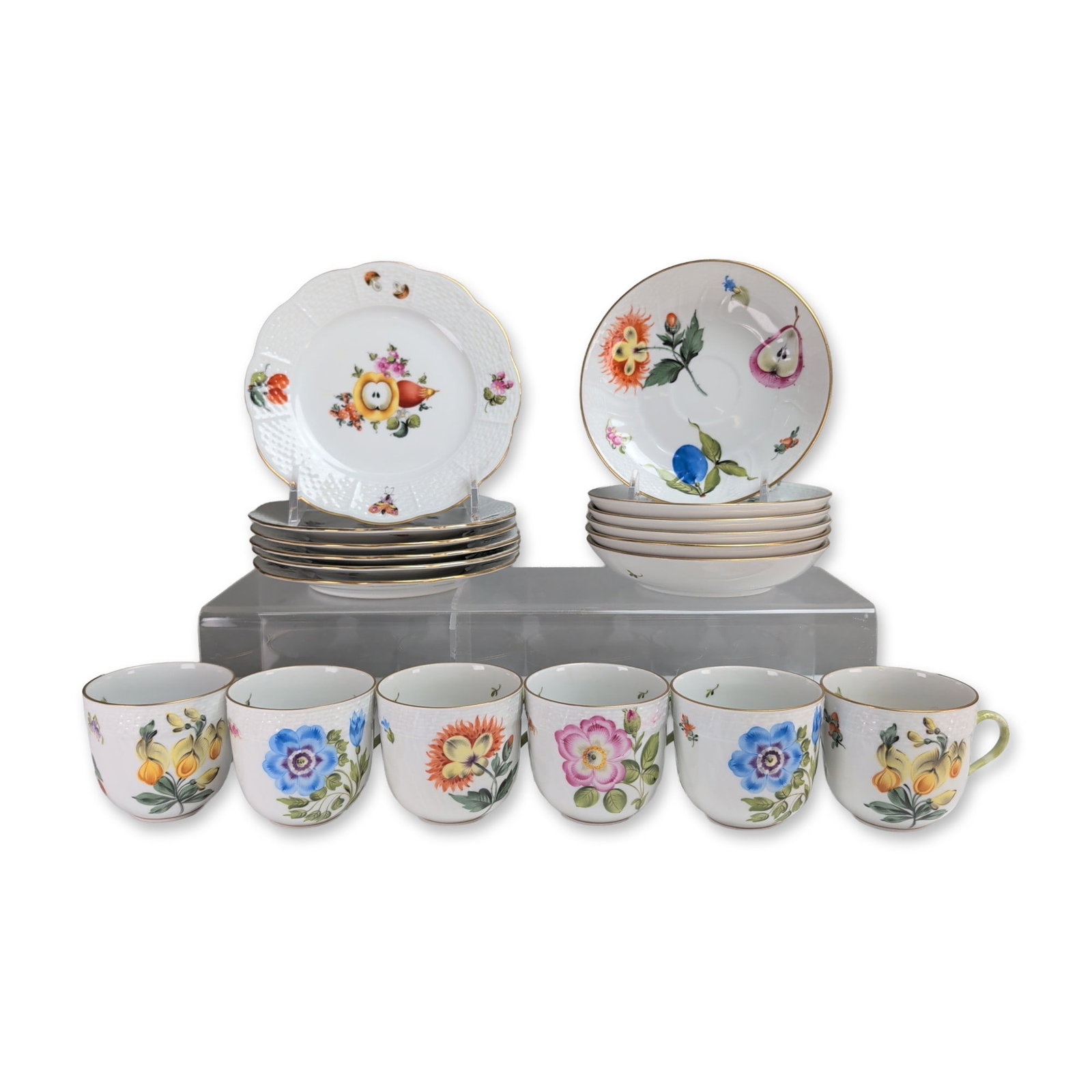 18pc Herend Hungary Fruits and Flowers Porcelain Dessert Service: Herend hand-painted fine porcelain eighteen pieces dessert service for six. The collection includes six cups, six saucers, and six dessert plates, all featuring the Fruits and Flowers or Bouquet de He