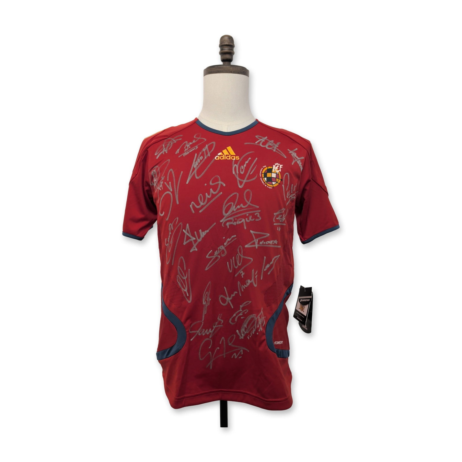 Signed 2010 Spain World Cup Adidas Soccer Jersey: Adidas Spain National Team home jersey, 2010 FIFA World Cup Formotion player-issue model in red synthetic technical fabric with navy blue trim. The front features a heat-applied Real Federacion Espano