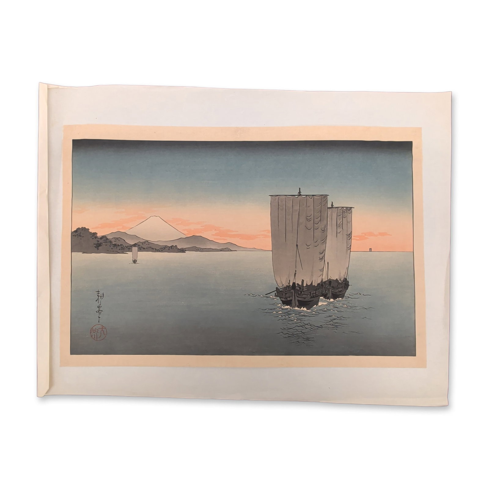 Shoda Koho (Japanese, 1871-1946), Woodcut on Paper, Sunset on Suruga Bay: Shoda Koho woodblock print on washi paper titled Sunset on Suruga Bay. The horizontal composition features a traditional sailing vessel in the mid-ground, with Mt. Fuji silhouetted against a sunset